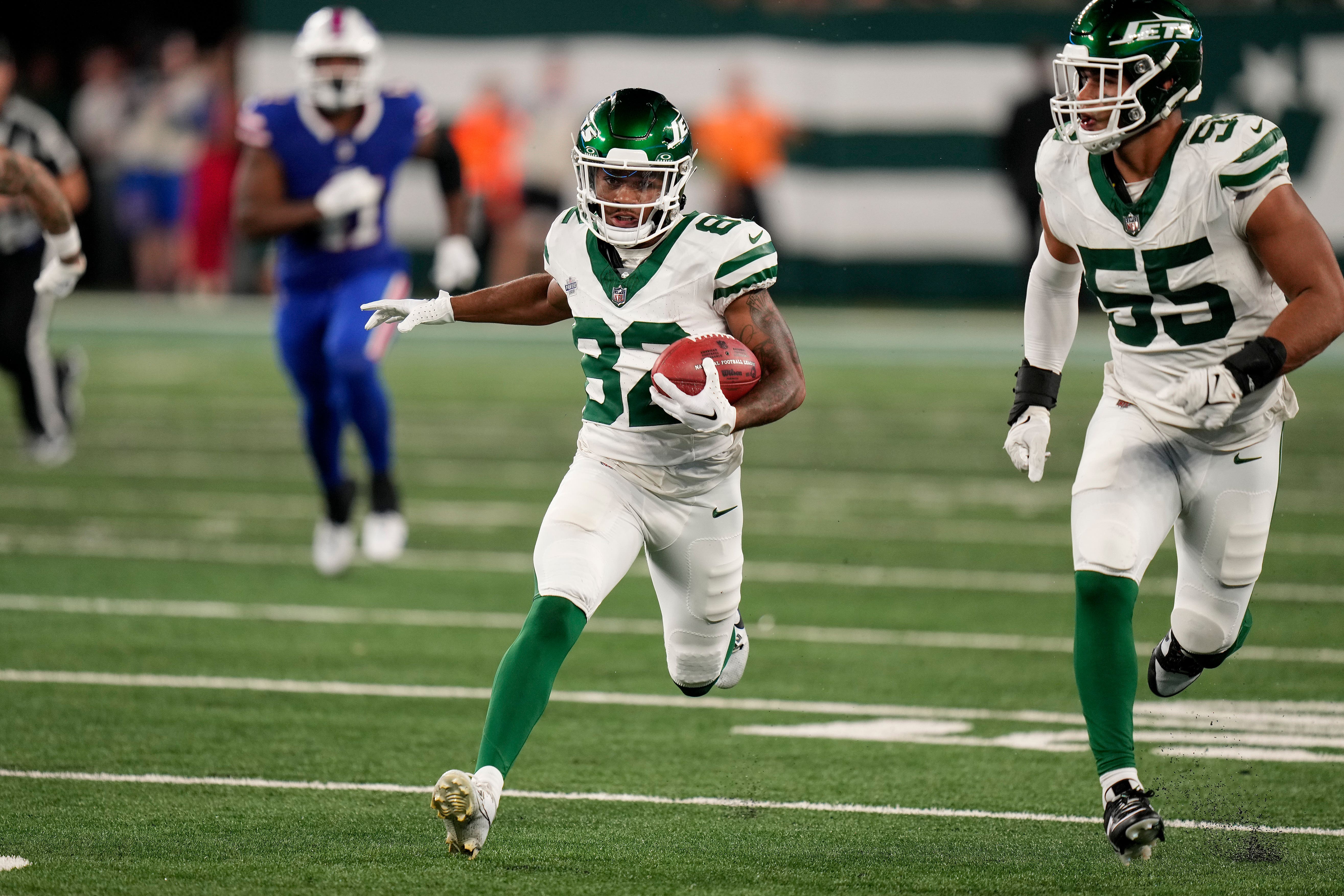 New York Jets wide receiver Xavier Gipson (82) returns a punt for a touchdown to win the game against the Buffalo Bills in overtime (Seth Wenig/ AP)