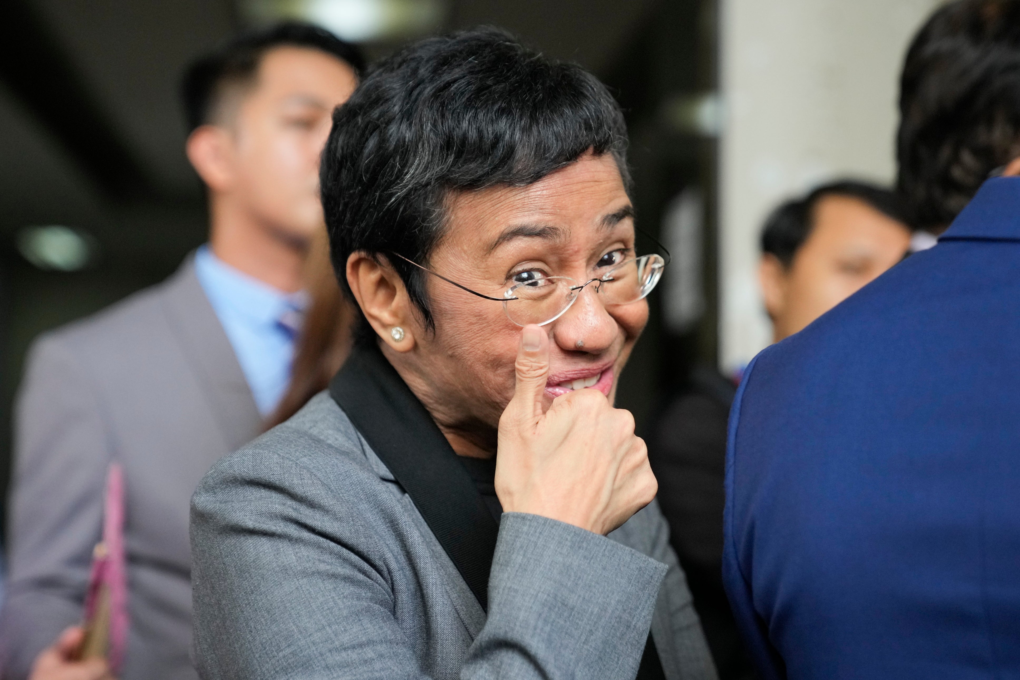 Filipino journalist Maria Ressa, 2021 Nobel Peace Prize winner and Rappler CEO, gestures as she talks to reporters after being acquitted by the Pasig Regional Trial Court over a tax evasion case in Pasig city, Philippines on Tuesday, 12 September 2023