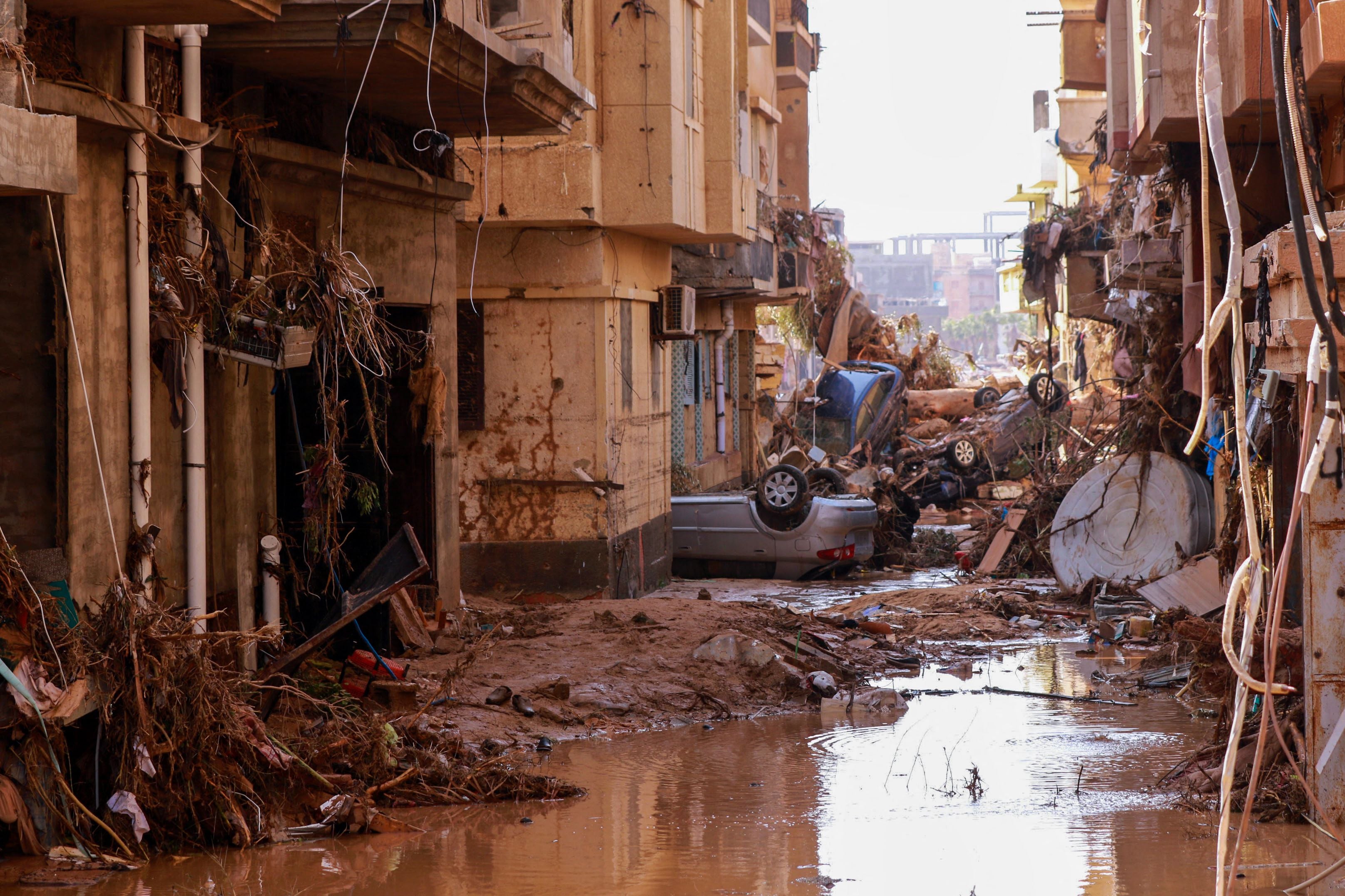 Overturned cars and other debris caused by catastrophic flash floods in Derna, eastern Libya