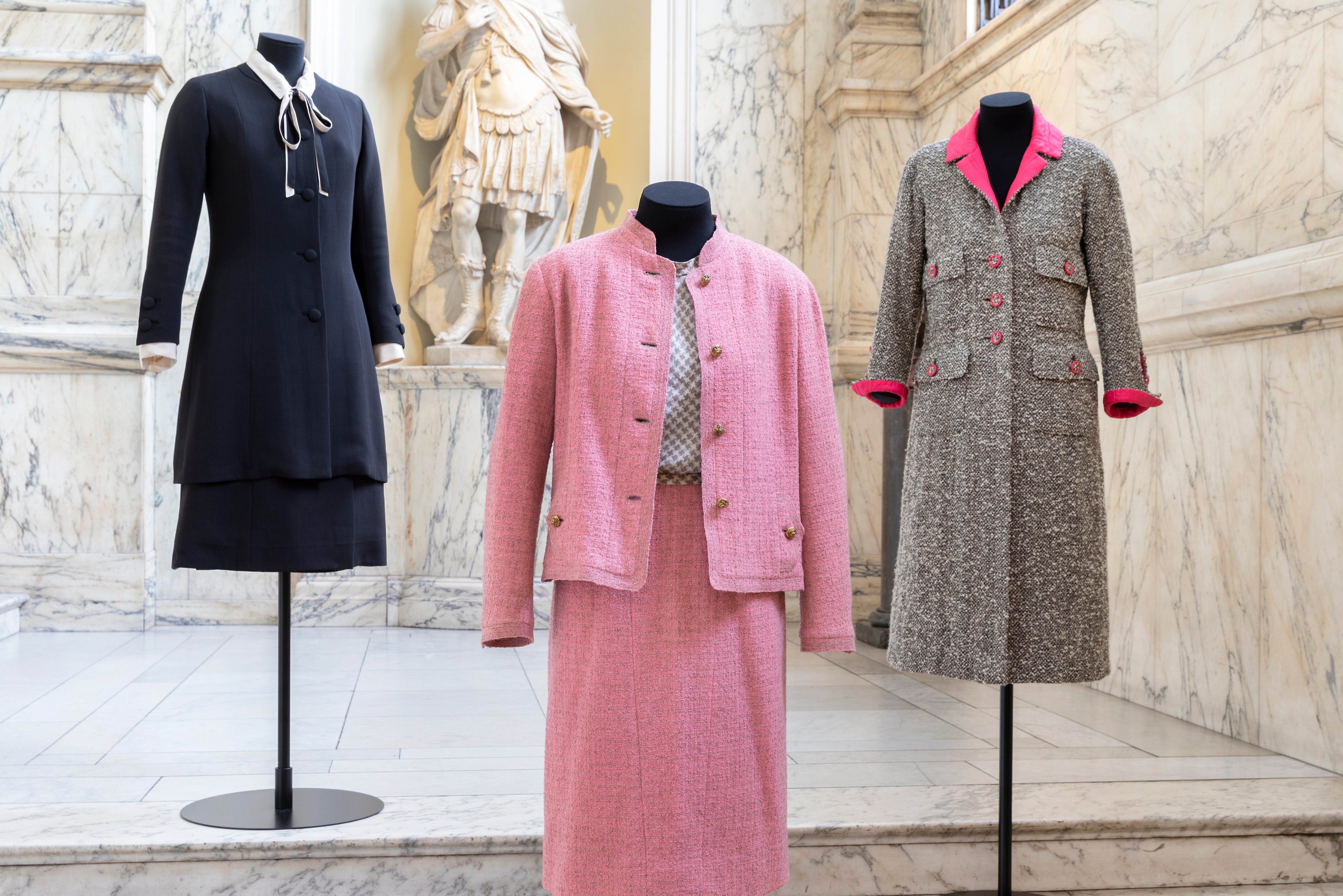 Three of Chanel’s outfits on display at the exhibition