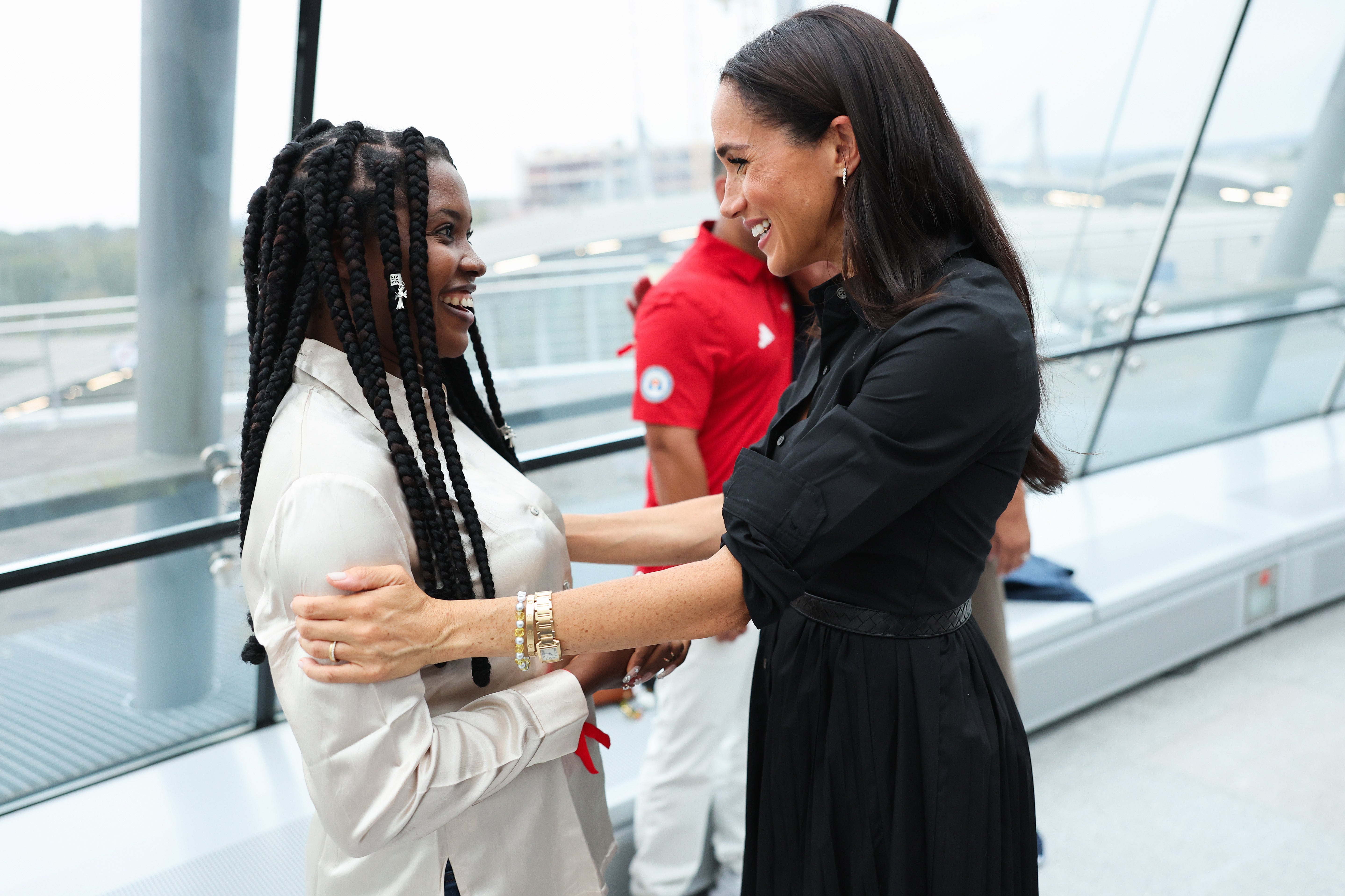 Ms Markle meets Glory Essien at the "Friends @ Home Event" at the Station Airport during day three of the Invictus Games