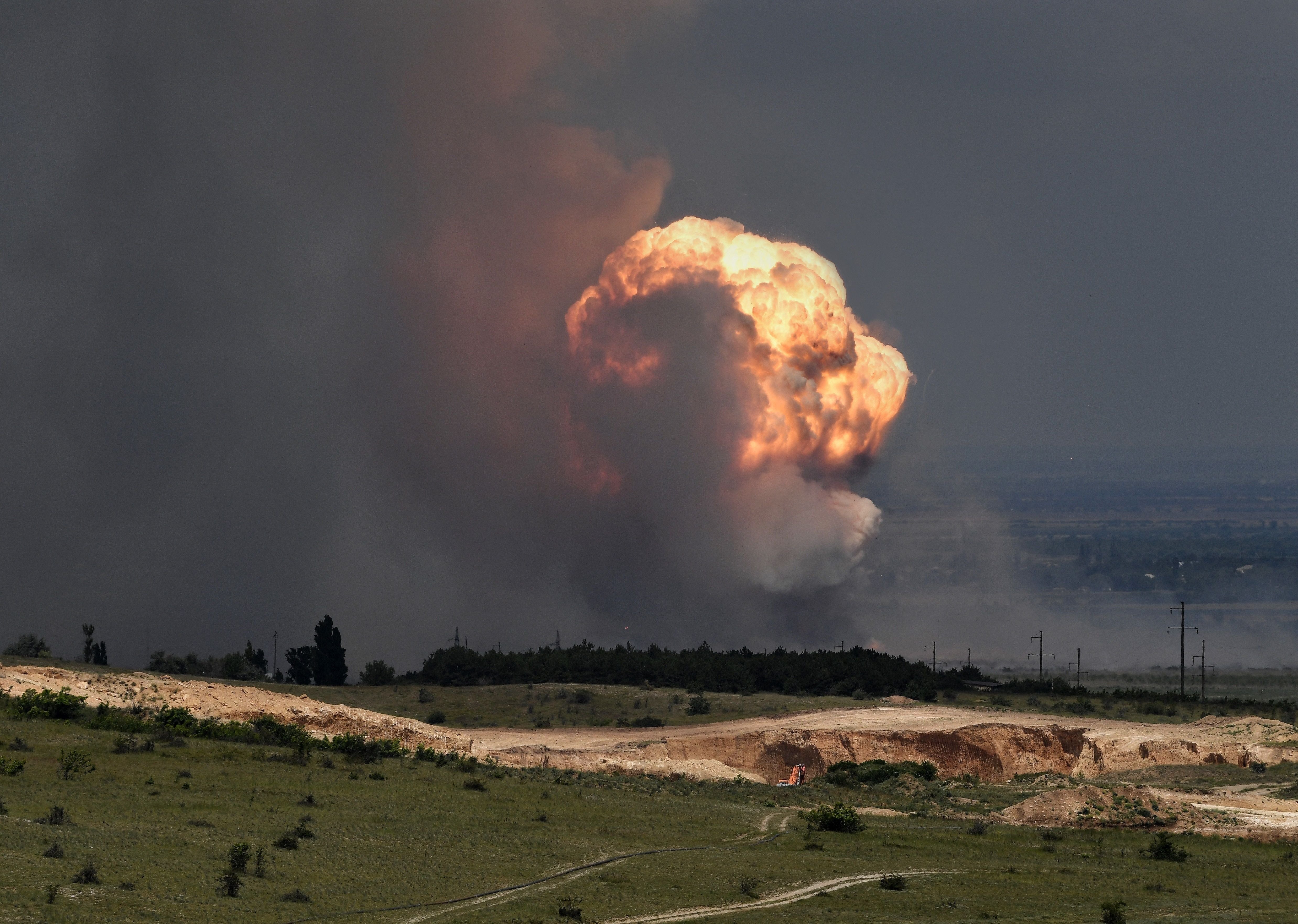 Detonation of ammunition caused by a fire at a military training field in the Kirovsky district in Crimea