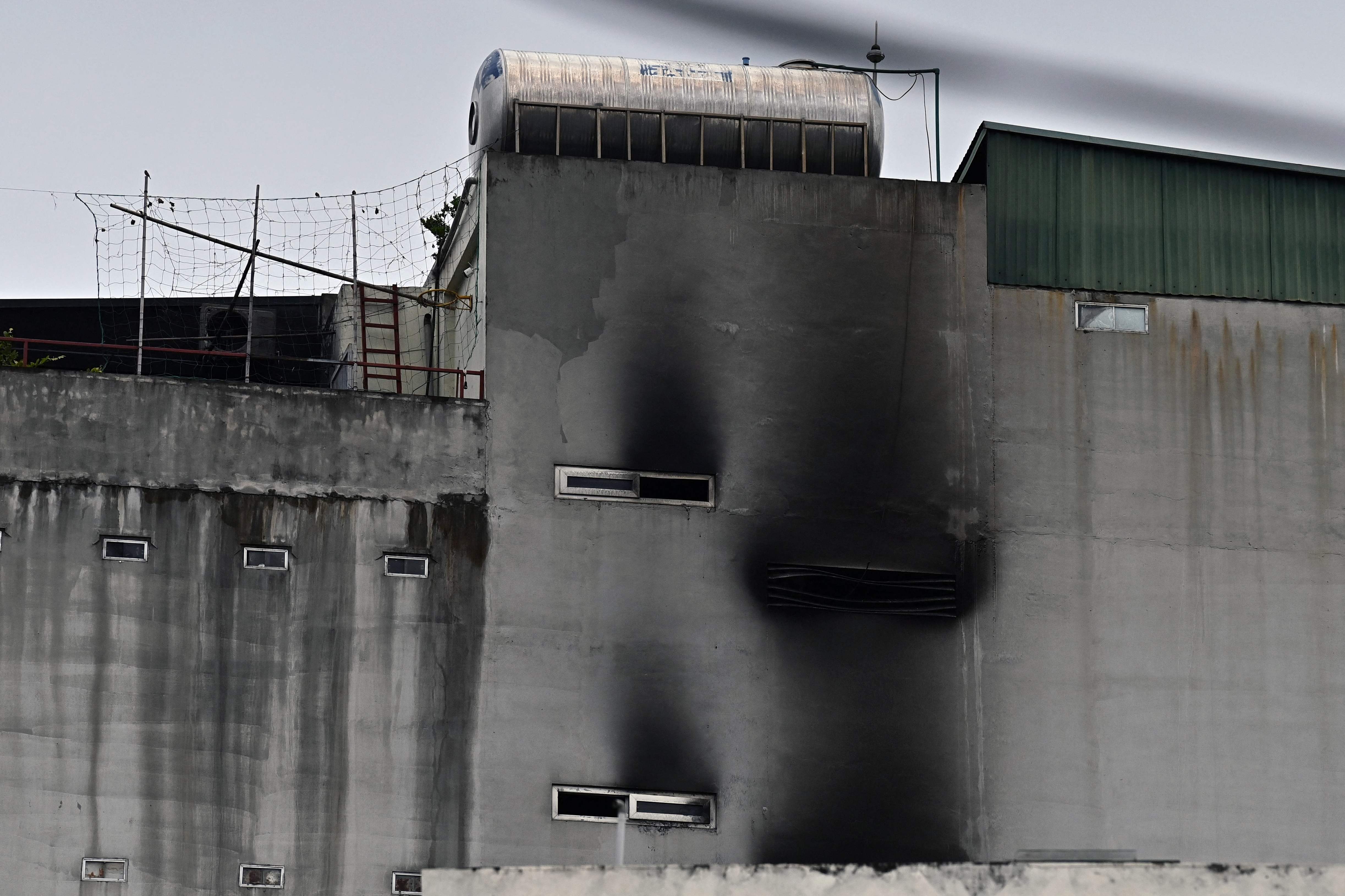 Smoke damage is pictured on the wall of an apartment block after a major fire in Hanoi on 13 September