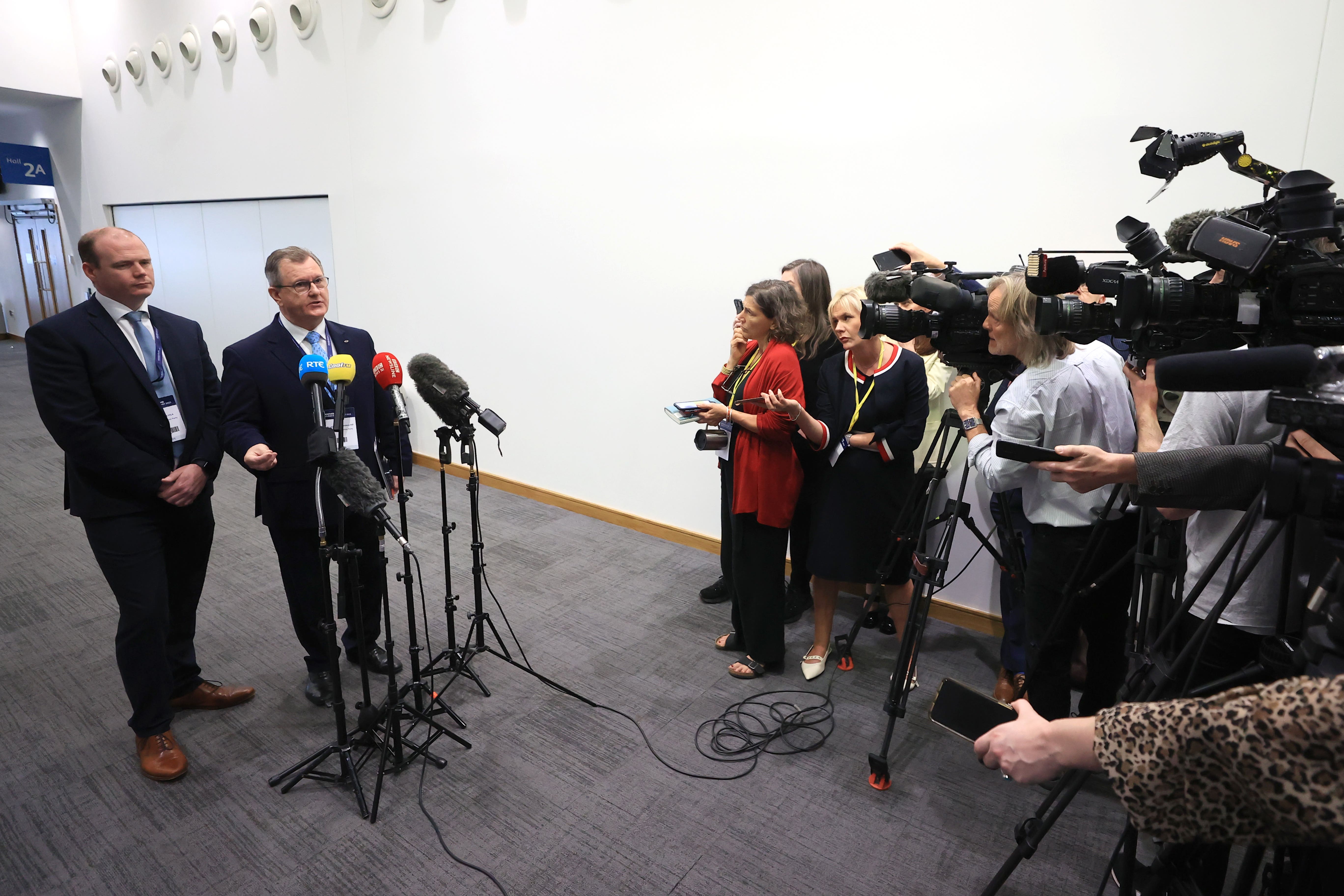 Democratic Unionist Party (DUP) leader Sir Jeffrey Donaldson (right) with Gordon Lyons speaking to the media during the Northern Ireland Investment Summit (Liam McBurney/PA)