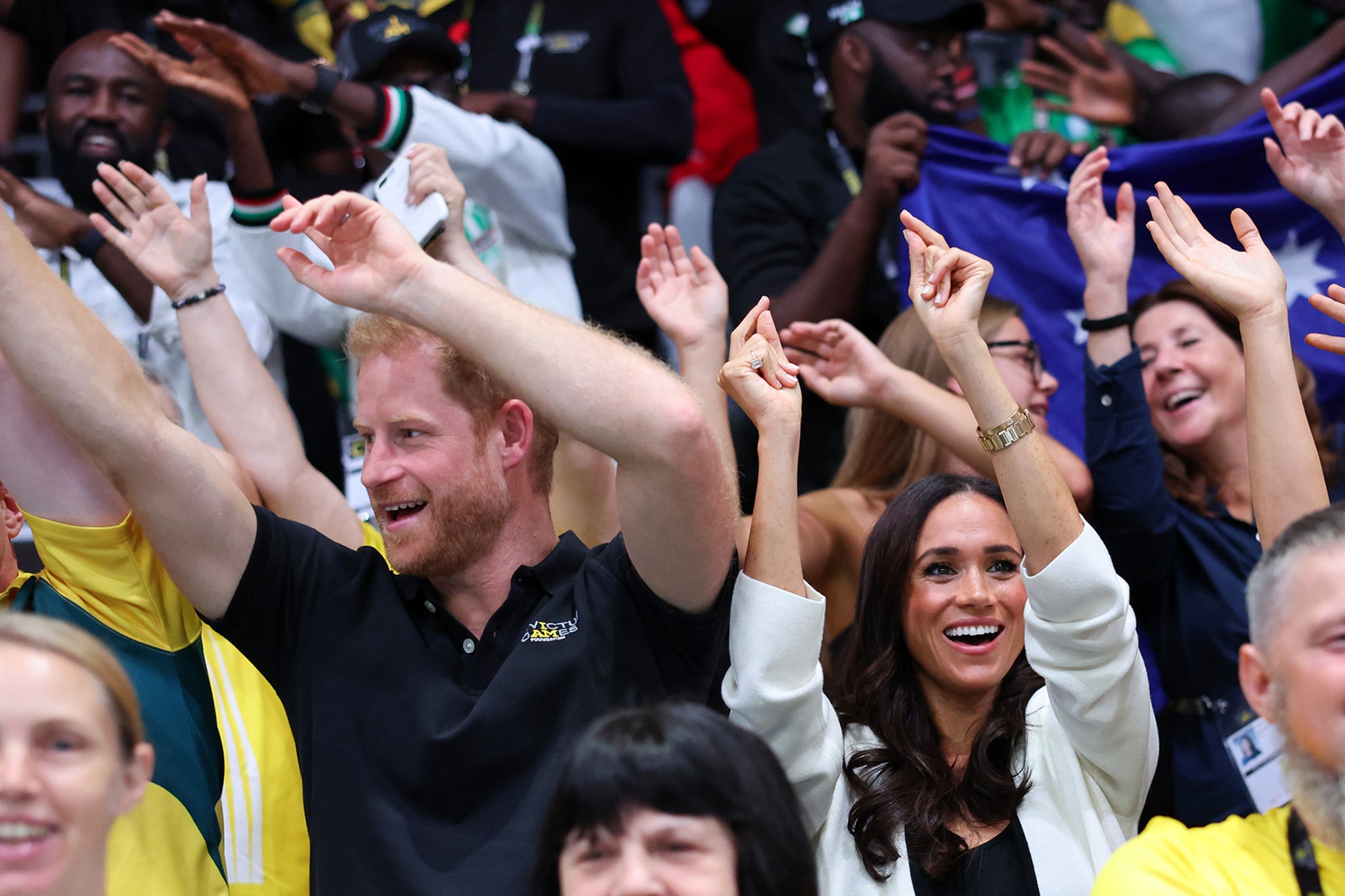 They were spotted waving along to songs in the crowd