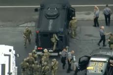 Pennsylvania police pose with captured Danelo Cavalcante after he led them on two-week chase