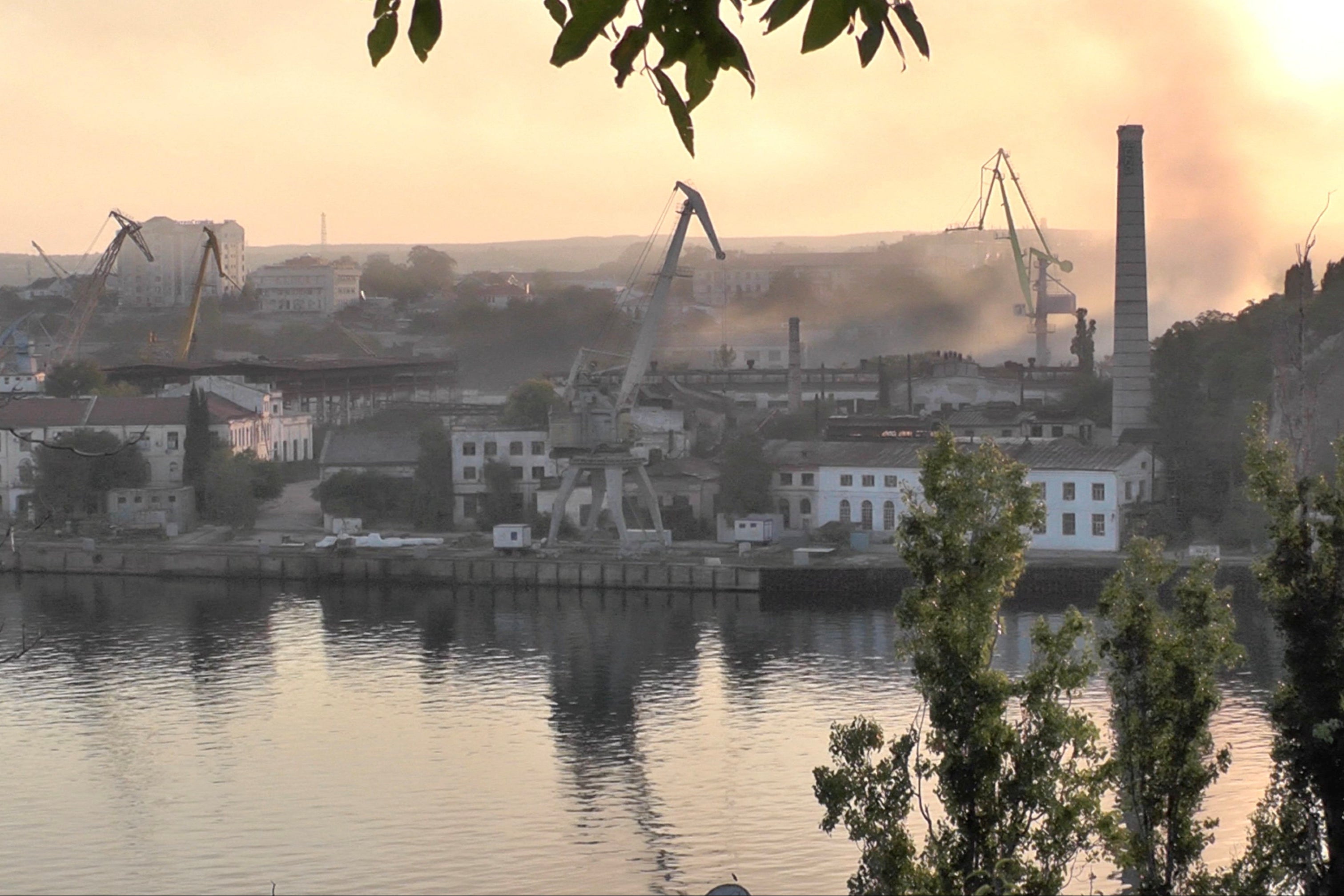 Smoke rises from the shipyard hit by Ukraine in Sevastopol