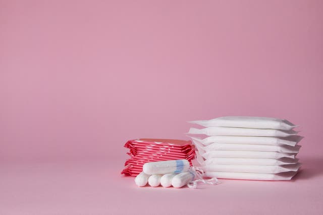 <p>Stack of menstrual sanitary cotton pads and tampons </p>