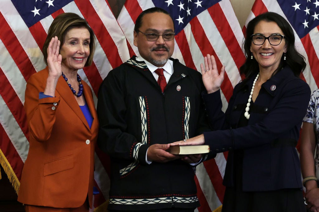 Gene Peltola, centre, participates in the swearing-in of his wife, Congresswoman Mary Peltola, in January.