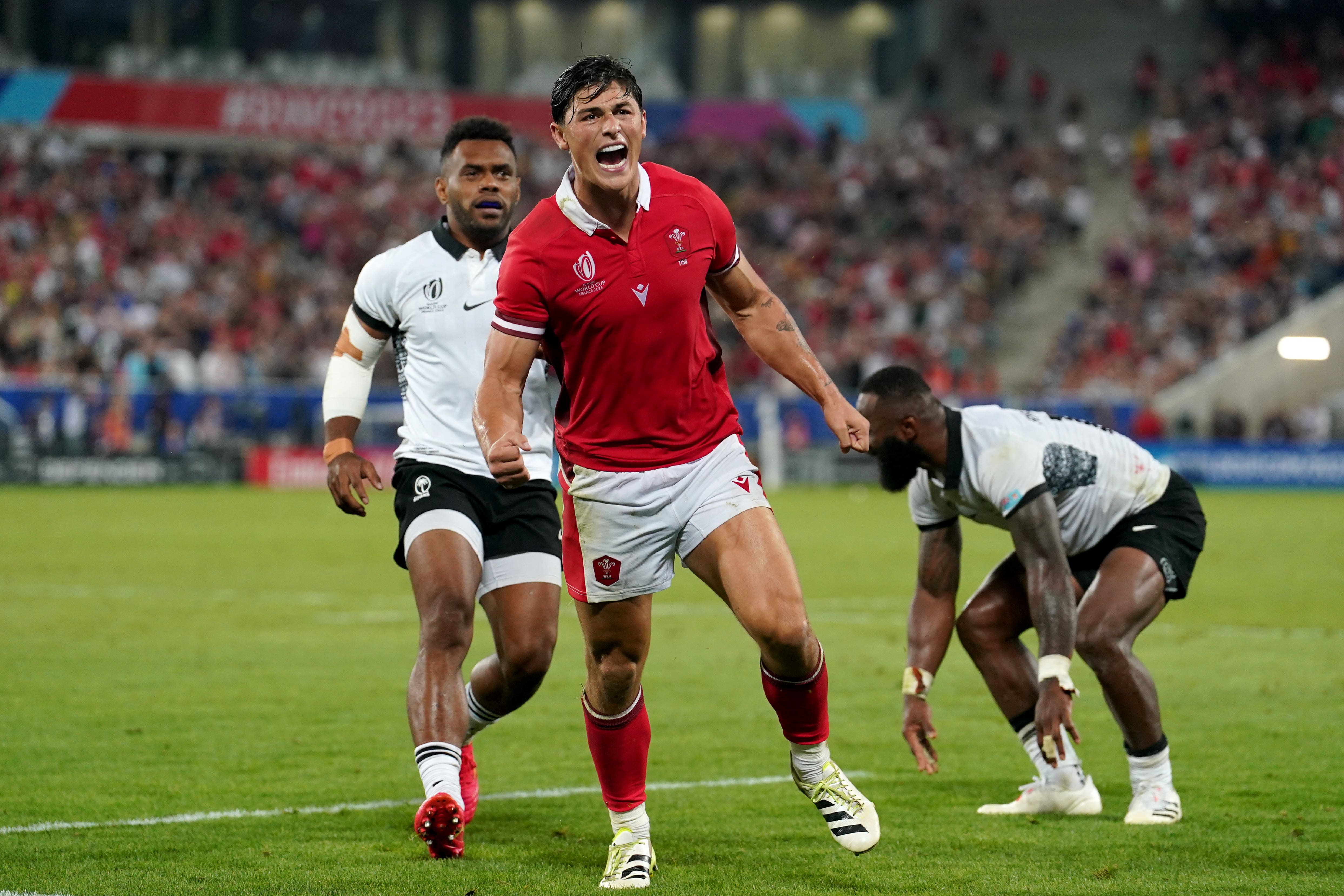 Louis Res-Zammit celebrates Wales’ World Cup win against Fiji (David Davies/PA)