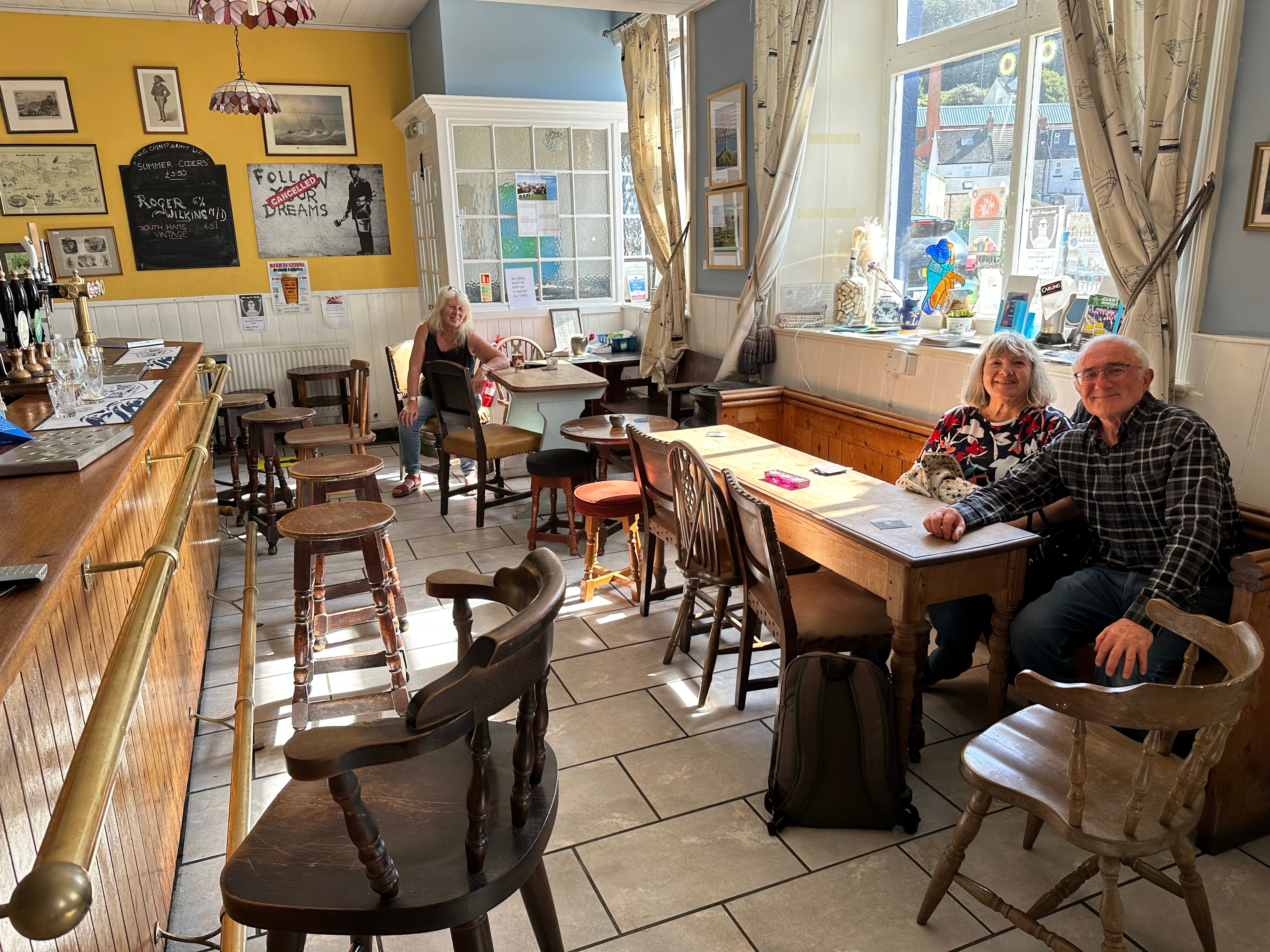 Inside local pub The Royal Portland Arms, where owner Jill Diggens and customers Philip and Ellen Zammit think the Bibby Stockholm plan is a bad idea