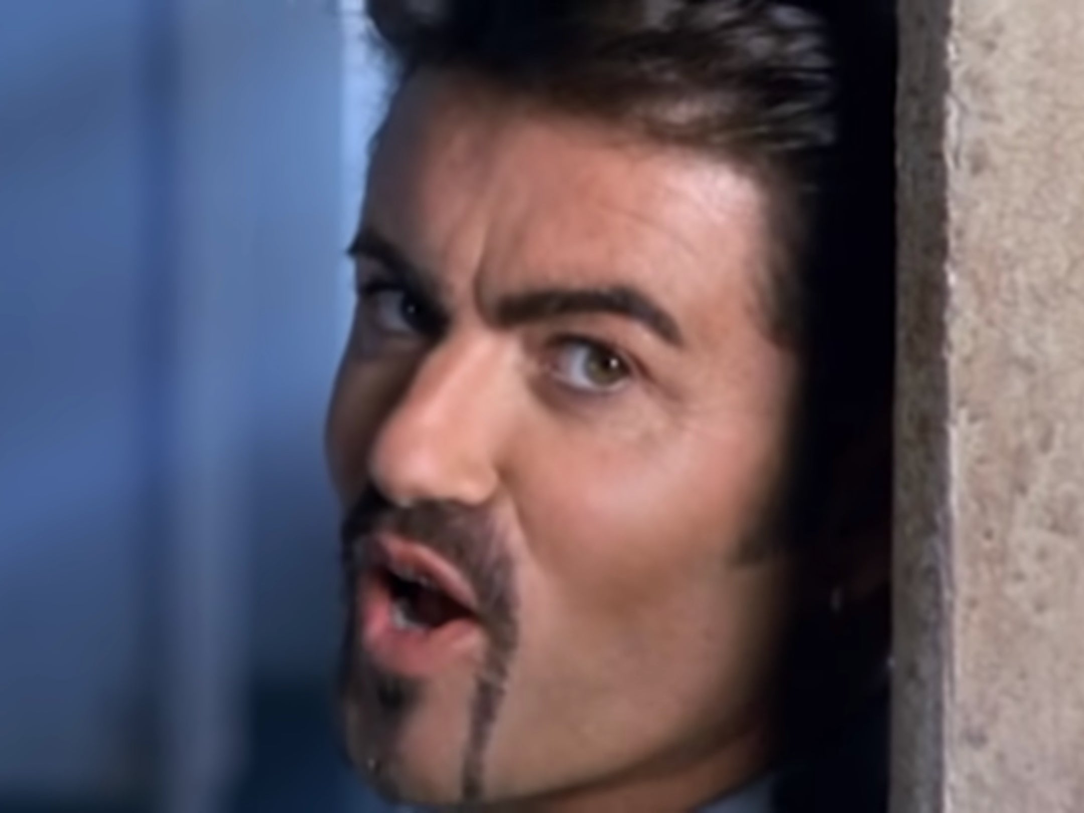 George Michael in the music video for ‘Outside’