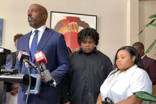 Attorney Cory Lynch speaks at a press conference with the baby’s parents Treveon Taylor and Jessica Ross