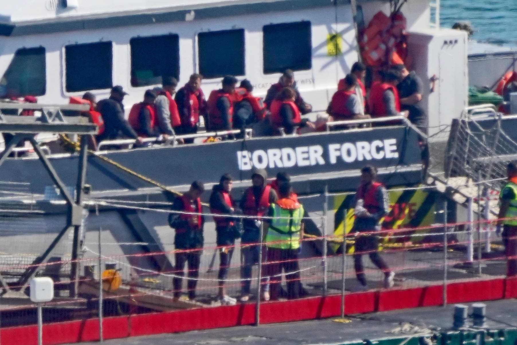 A group of people thought to be migrants are brought in to Dover, Kent, from a Border Force vessel following a small boat incident in the Channel on Thursday (Gareth Fuller/PA)