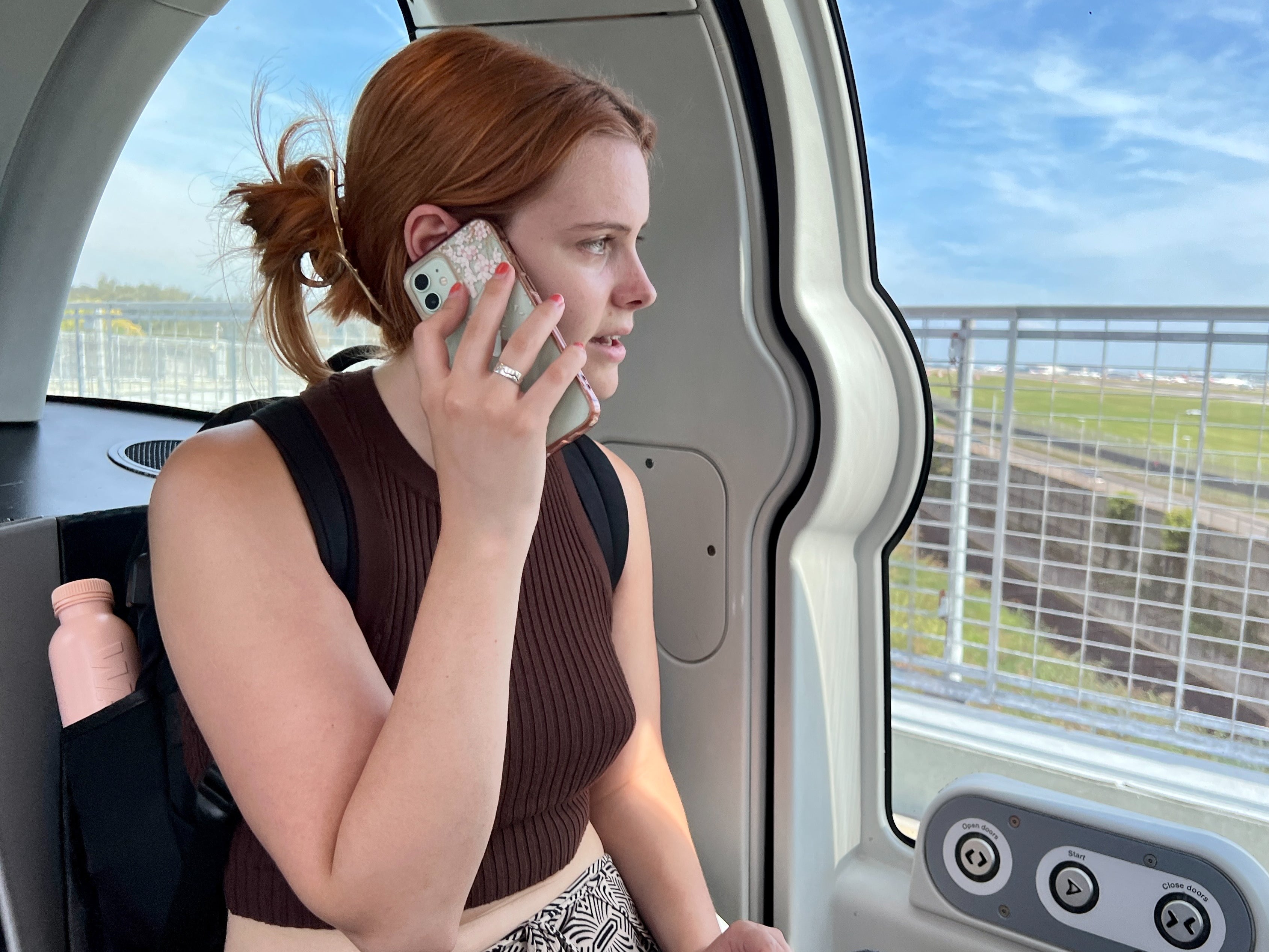 Hands free: Passenger in an autonomous pod shuttling between Heathrow airport Terminal 5 and a long-term car park