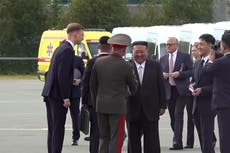 Kim Jong-un shakes hands with Russian defence minister on visit to military site