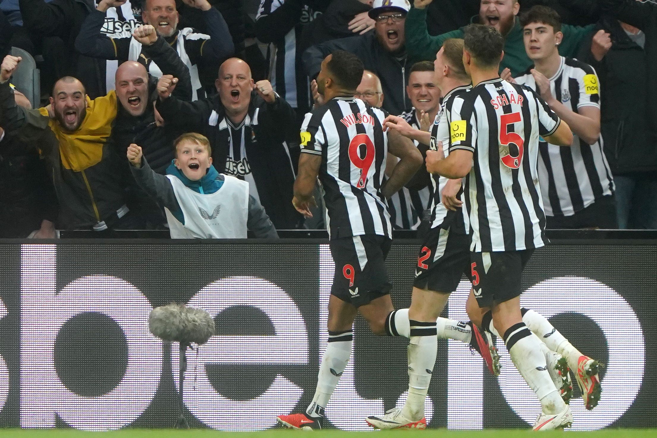 Callum Wilson, left, celebrates after scoring Newcastle’s winner (Owen Humphreys/PA)