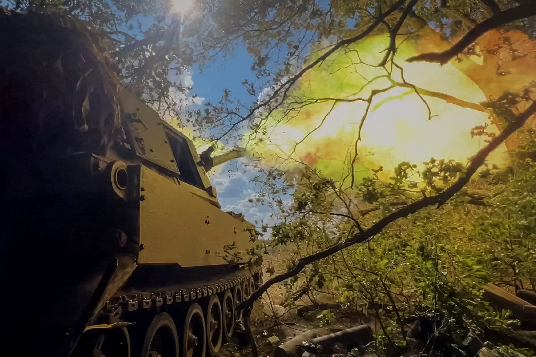 Ukrainian servicemen fire a M109 self-propelled howitzer towards Russian troops in Donetsk