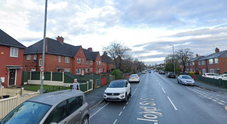 A man has died after a wall collapsed at a house in Lloyd Street South in Manchester