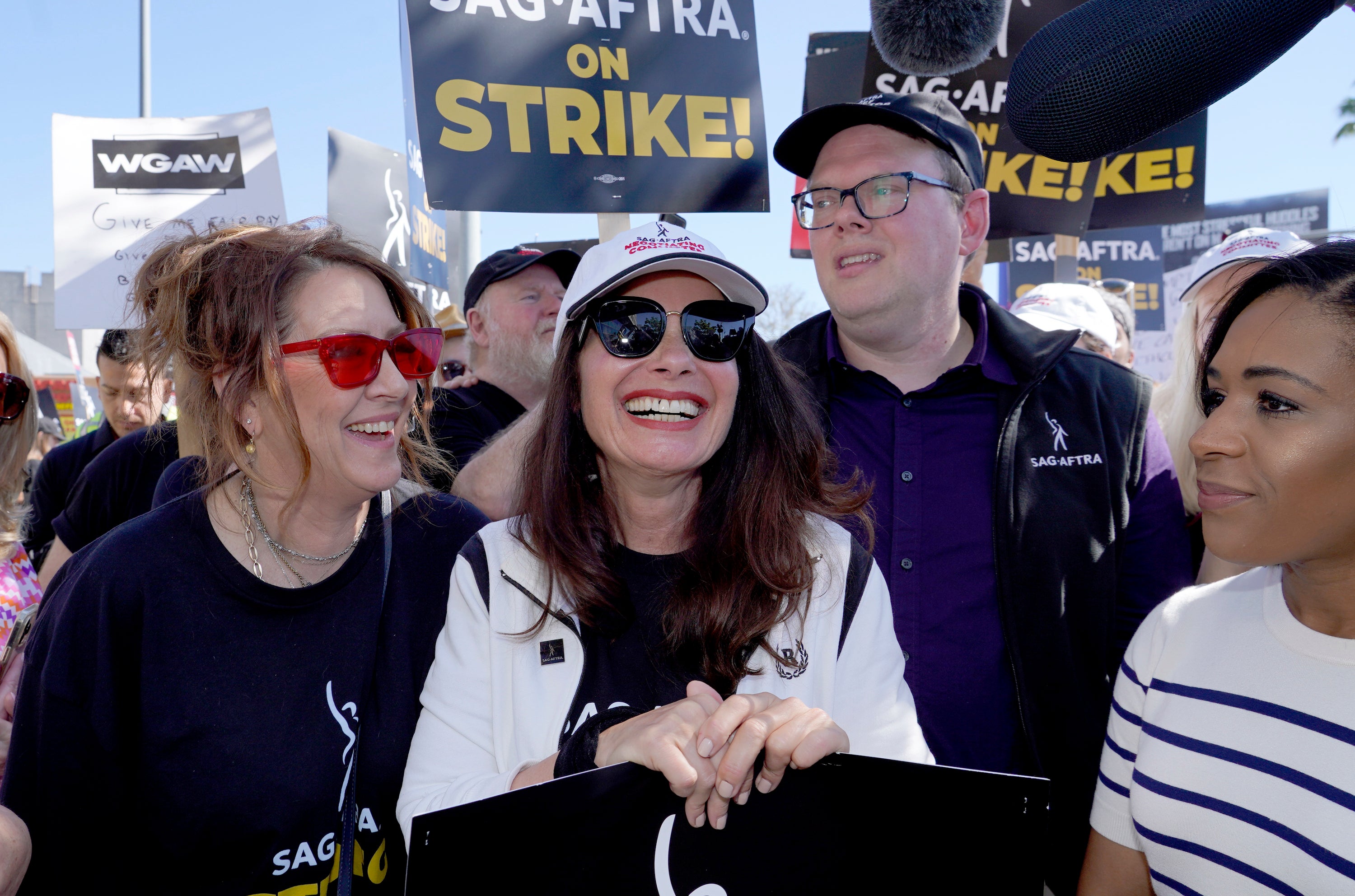 Actor Joely Fisher (left), SAG-AFTRA president Fran Drescher (centre) and Duncan Crabtree-Ireland (right), SAG-AFTRA national executive director and chief negotiator