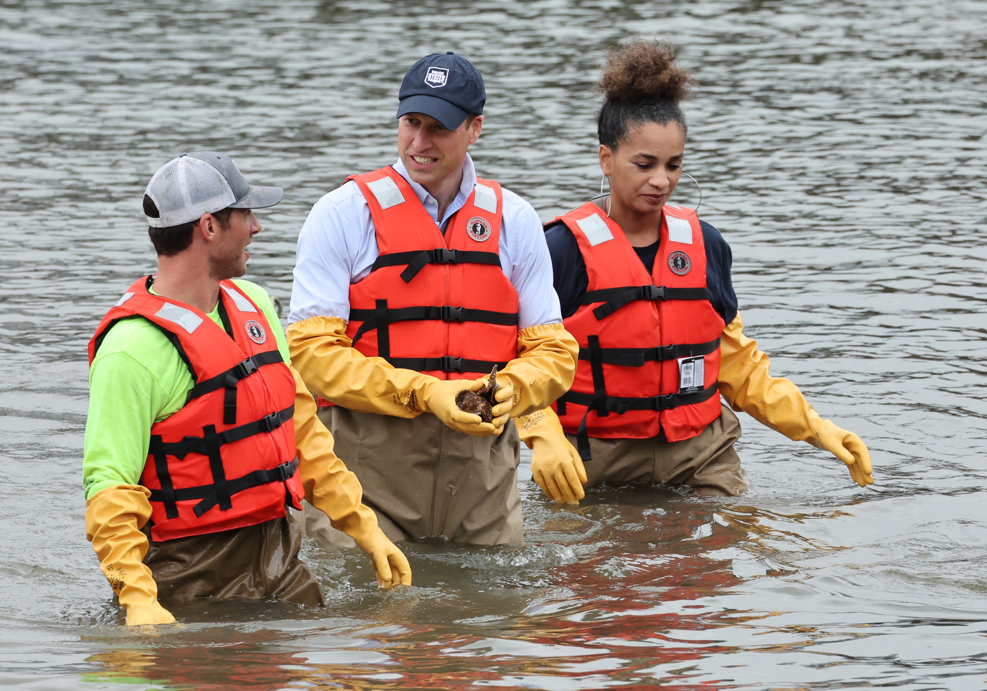 William, Prince of Wales, walks in the water as he visits the Billion Oyster Project in New York City on September 18, 2023