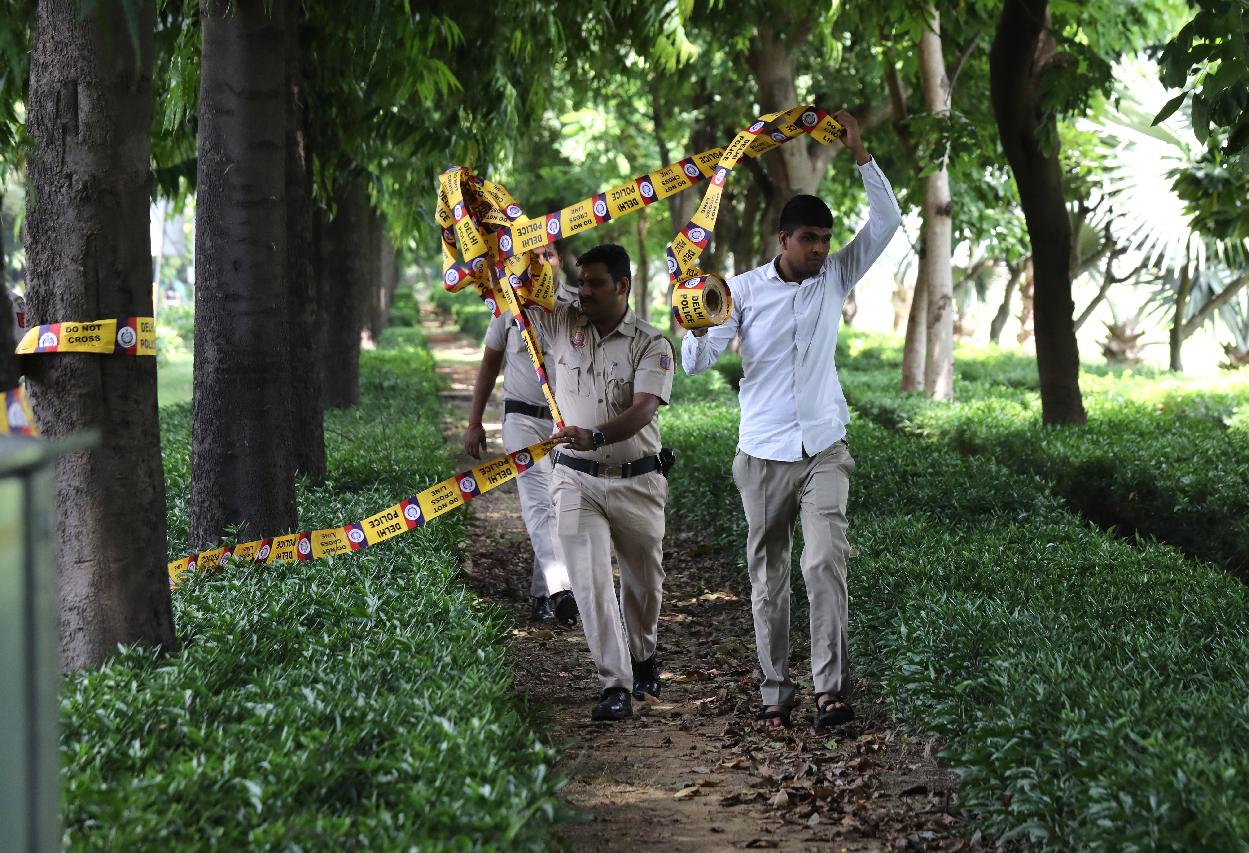 Indian policemen secure the premises around the Canadian embassy in New Delhi