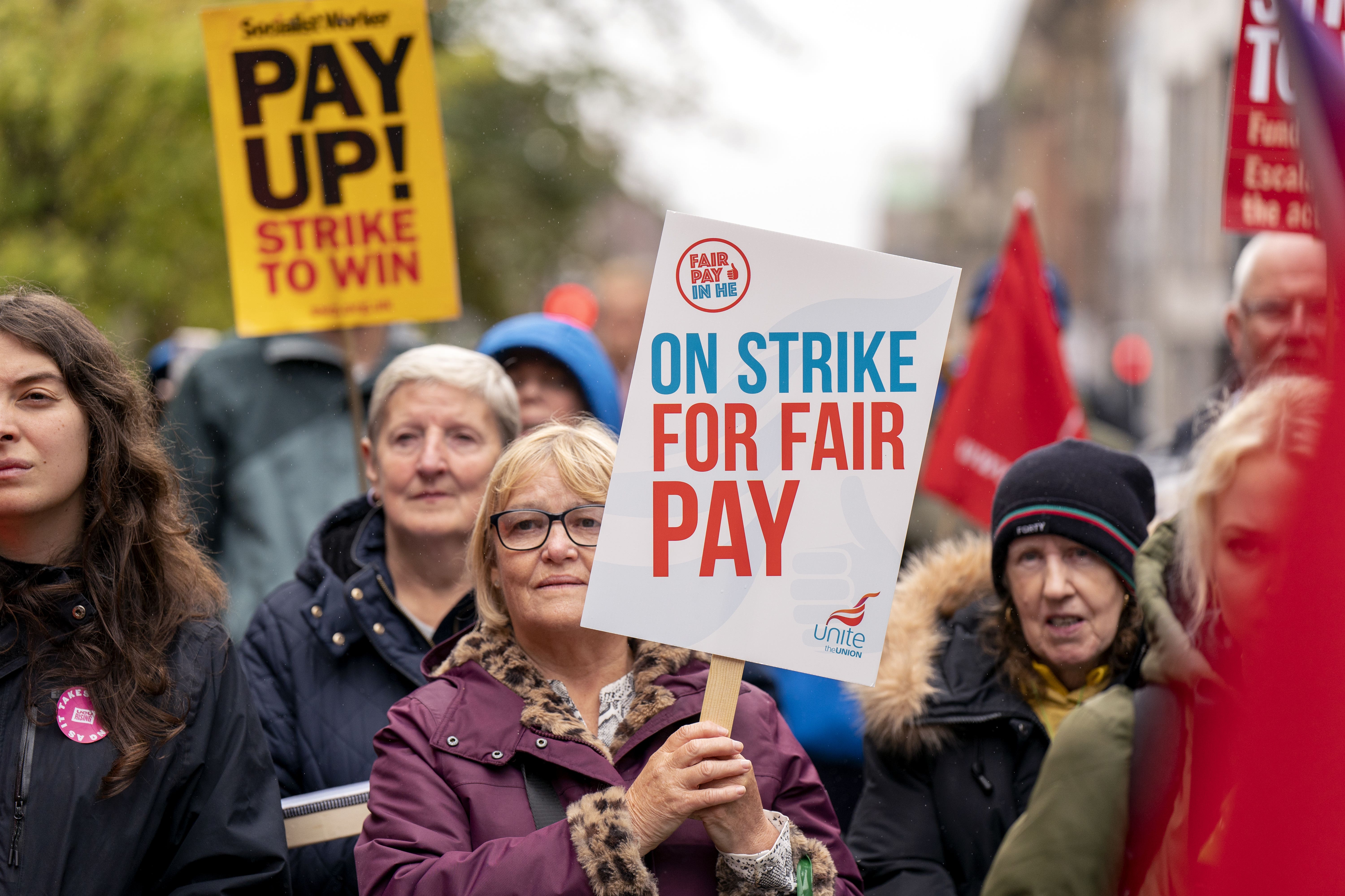 Lecturers and other university staff take part in a rally on Buchanan Street, Glasgow (Jane Barlow/PA)