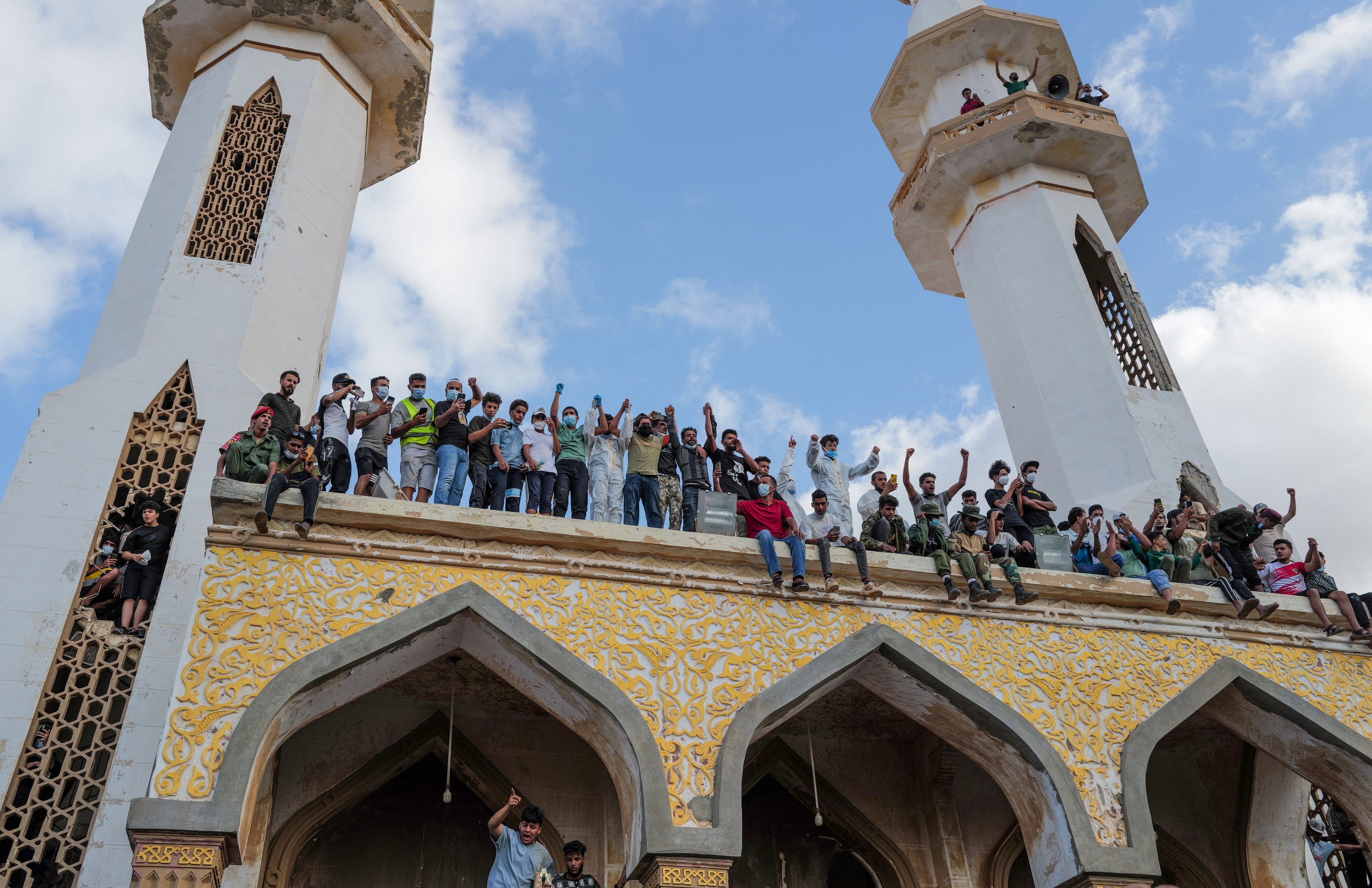 Libyans protest outside the mosque one week after the deadly floods in Derna