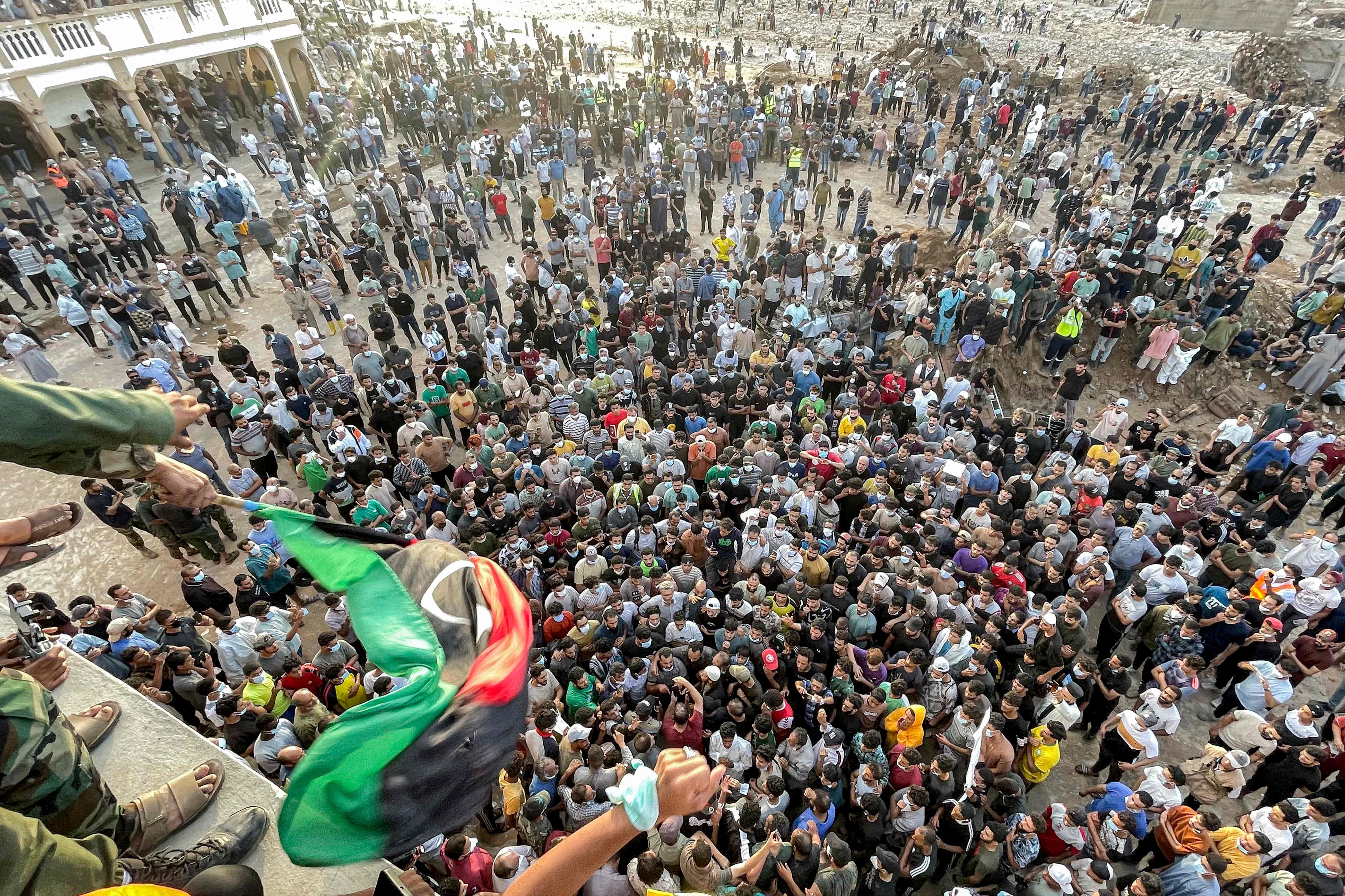 People gather for a demonstration outside the al-Sahaba Mosque in the city