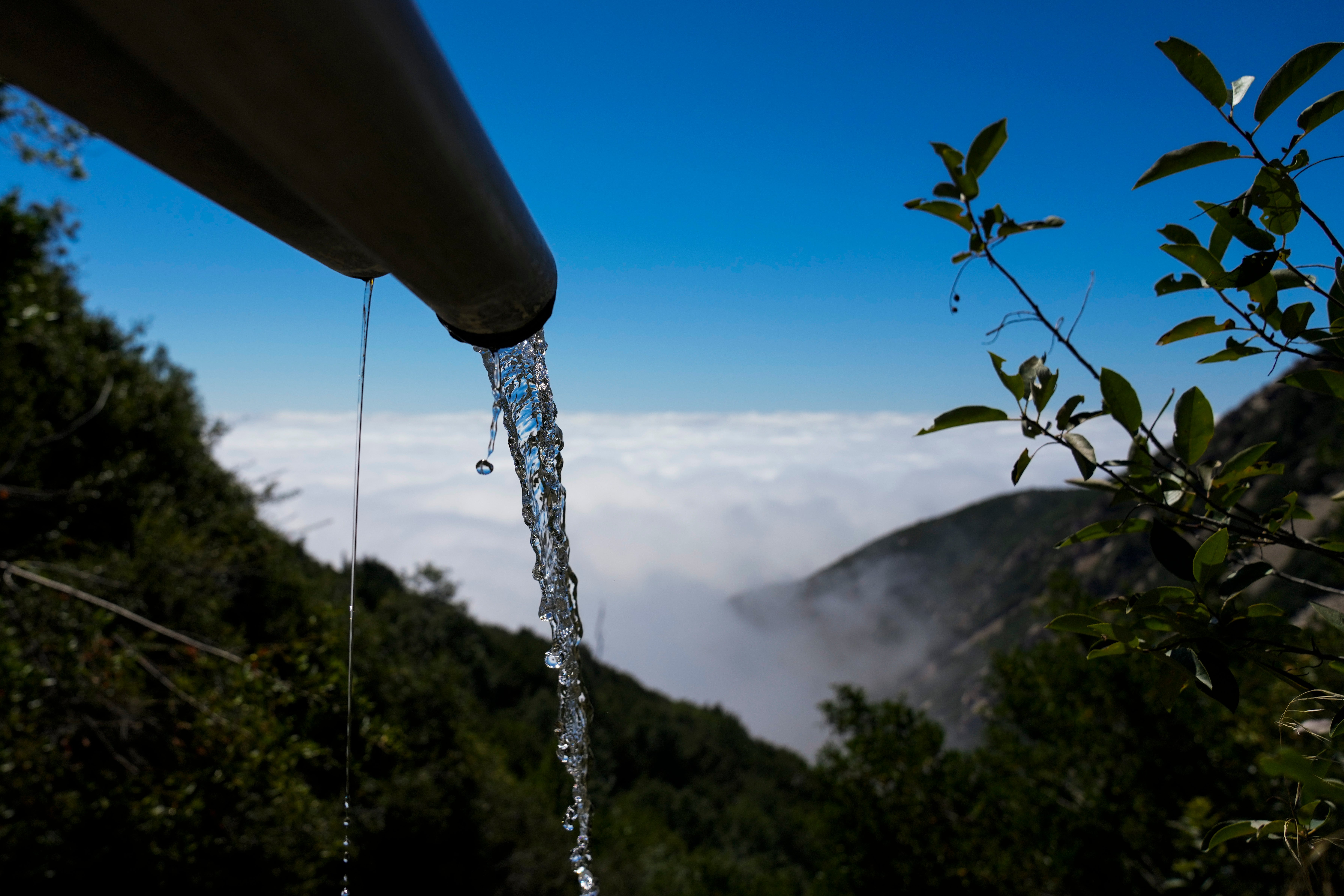 Spring water flows from a BlueTriton pipe in the San Bernardino National Forest on Monday, Sept. 18, 2023, in San Bernardino, Calif