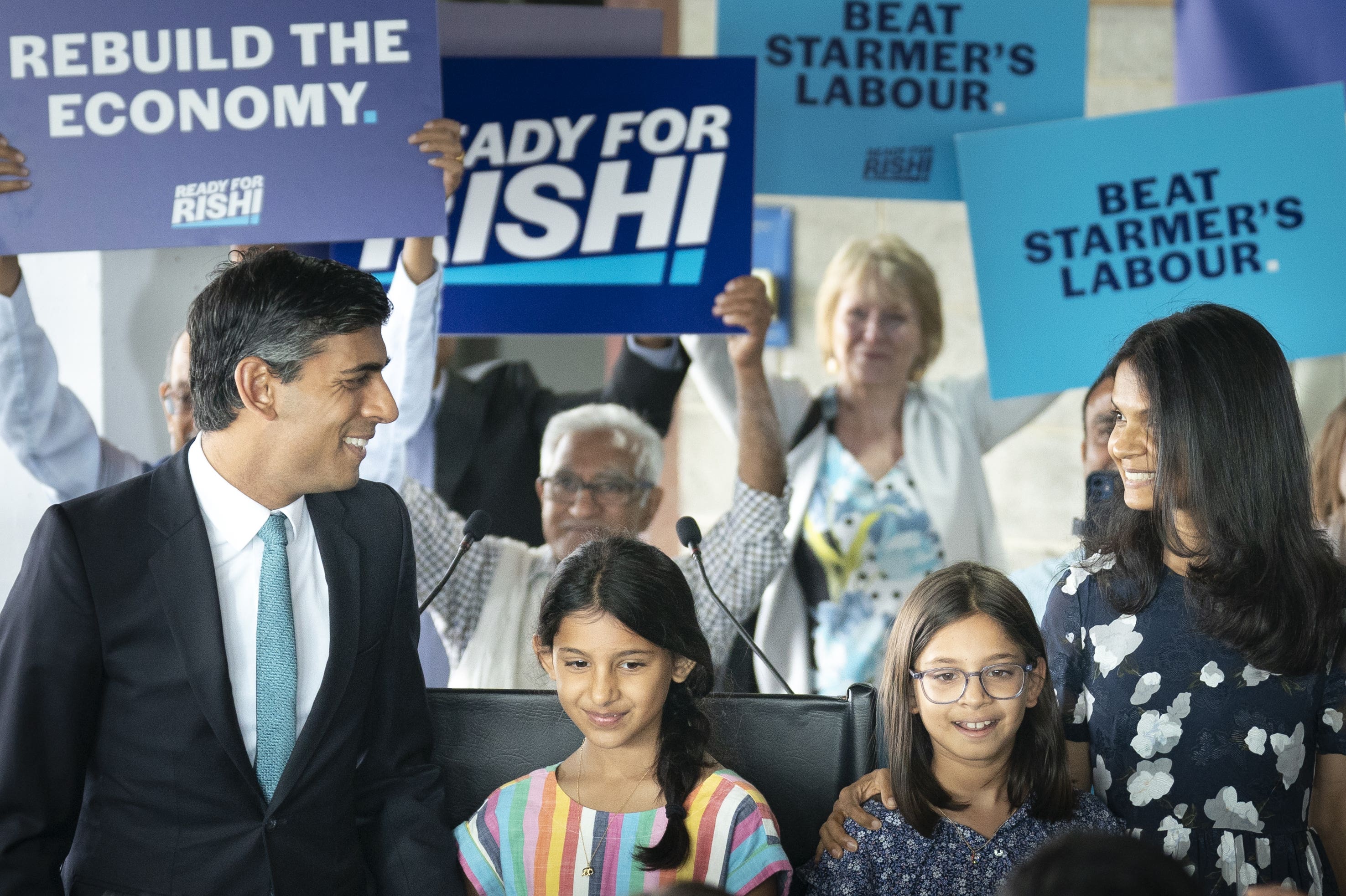 Rishi Sunak with daughters Krishna and Anoushka (Danny Lawson/PA)