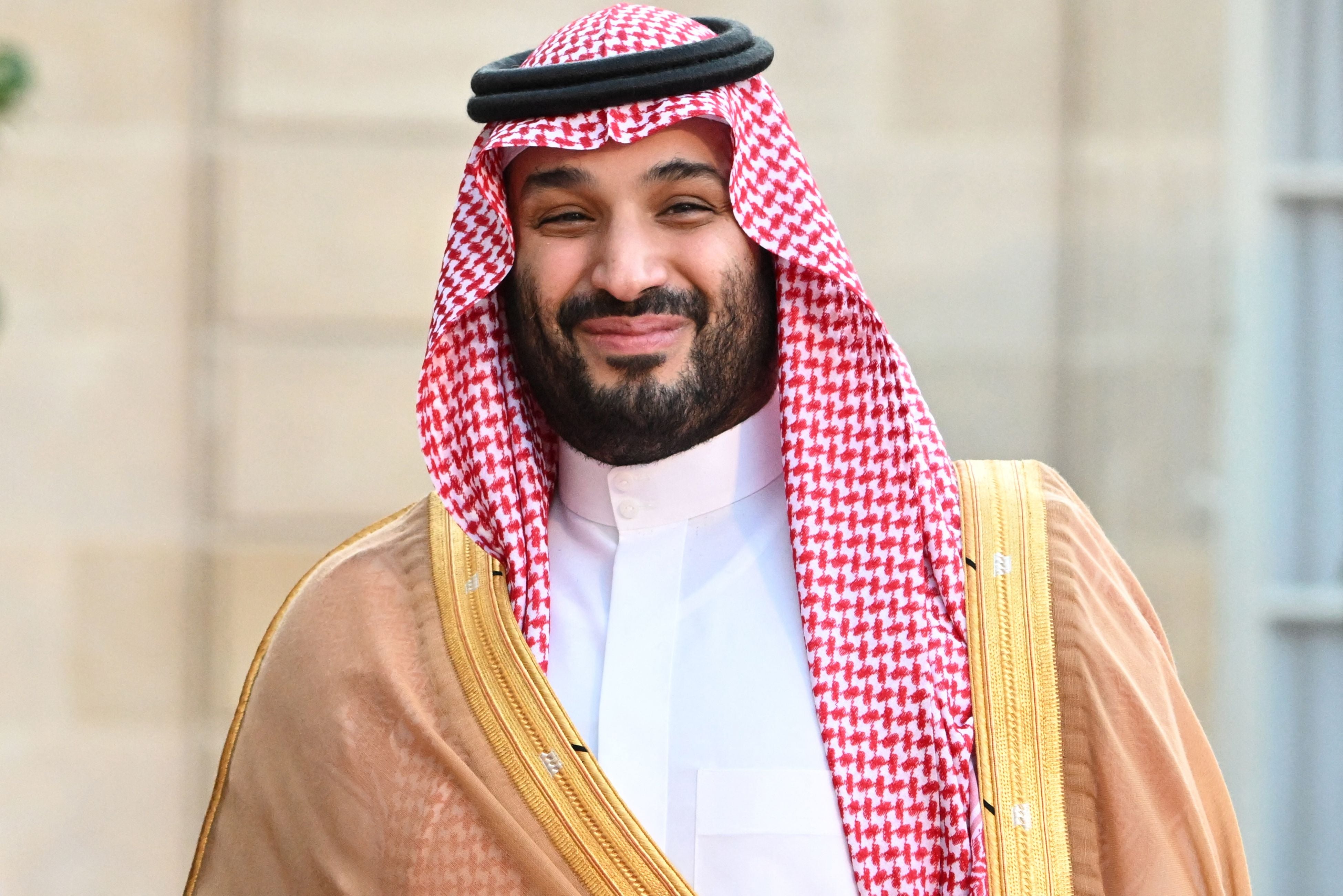 Saudi Crown Prince Mohammed bin Salman smiles as he arrives at the Elysee Palace in Paris on July 28, 2022 for a meeting with Emanuel Macron