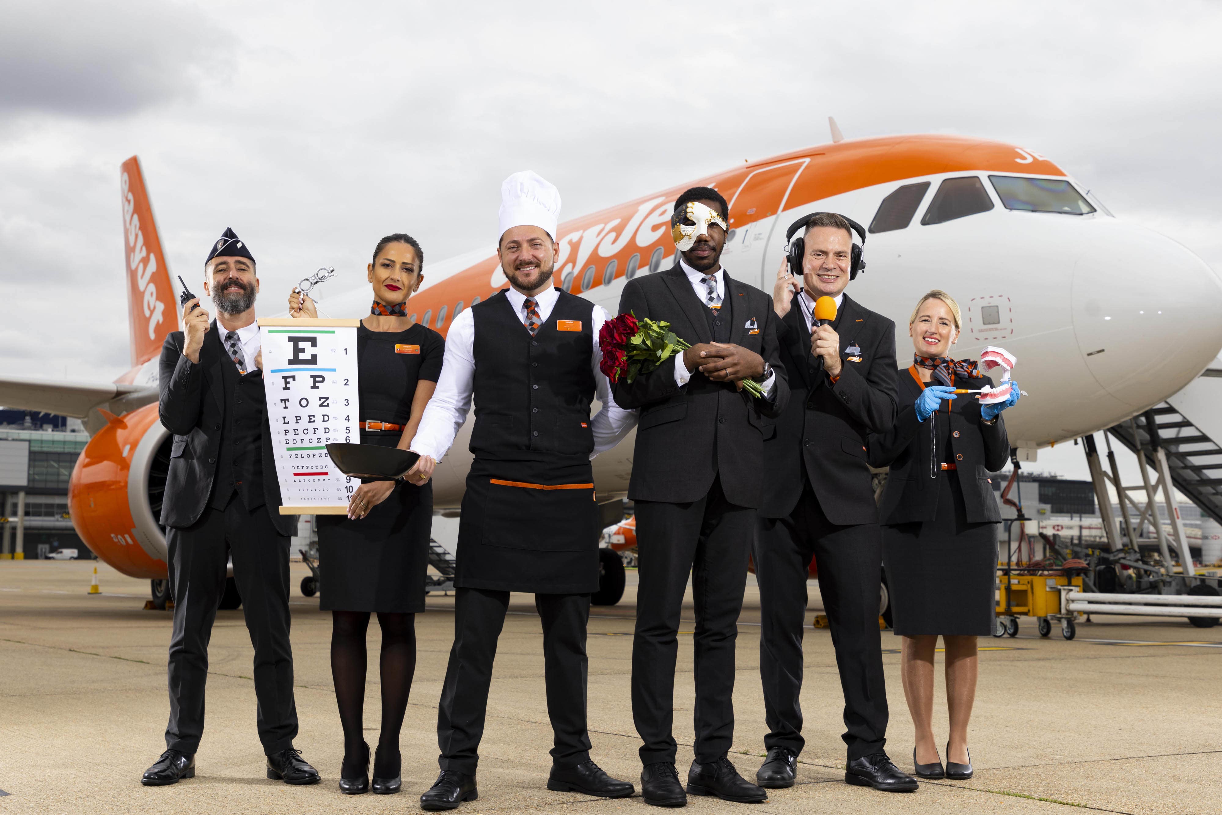 Former policeman Aurelien Gimenez, ex-optician Joumana Maallawi, former chef George Dogaru, ex-opera singer Thiago Beretta, former radio presenter Ian Gilmour, and ex-dental nurse Nicole Blundy front a new easyJet cabin crew recruitment campaign (David Parry/PA)