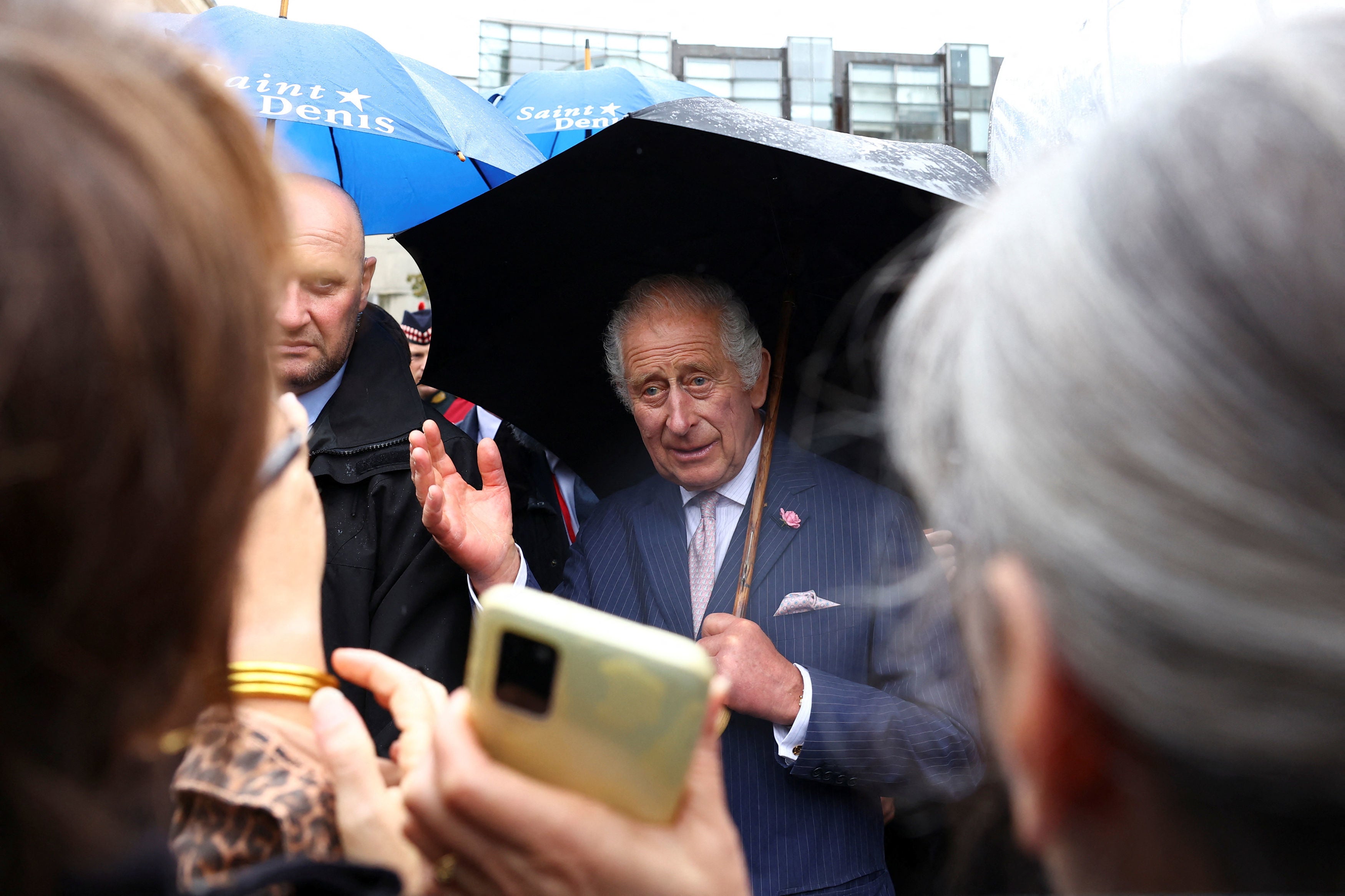 King Charles greets crowds at a Parisian flower market named after his late mother