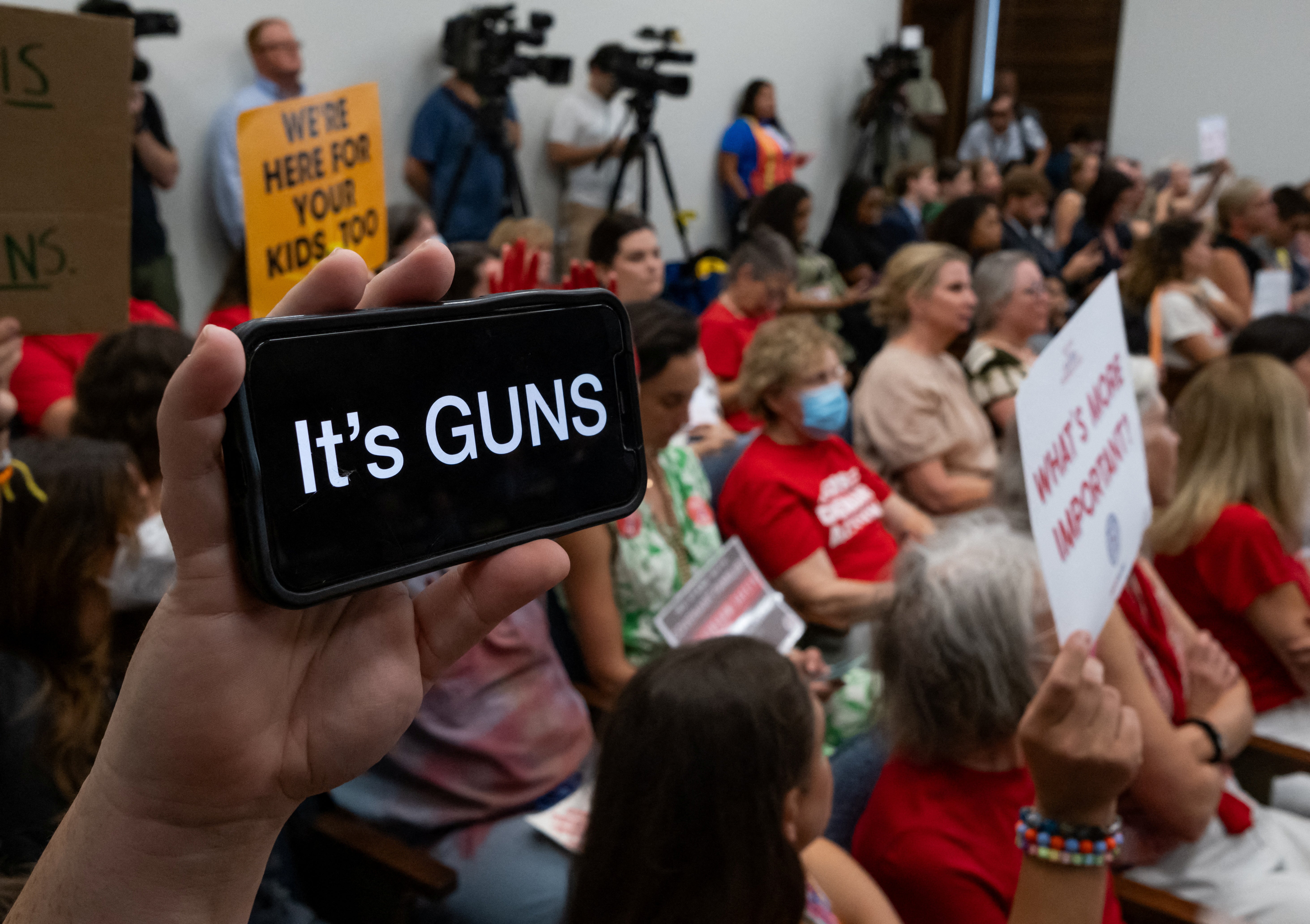 A supporter of gun reform holds their phone up during special state legislative session on gun violence in Tennesseee in August.