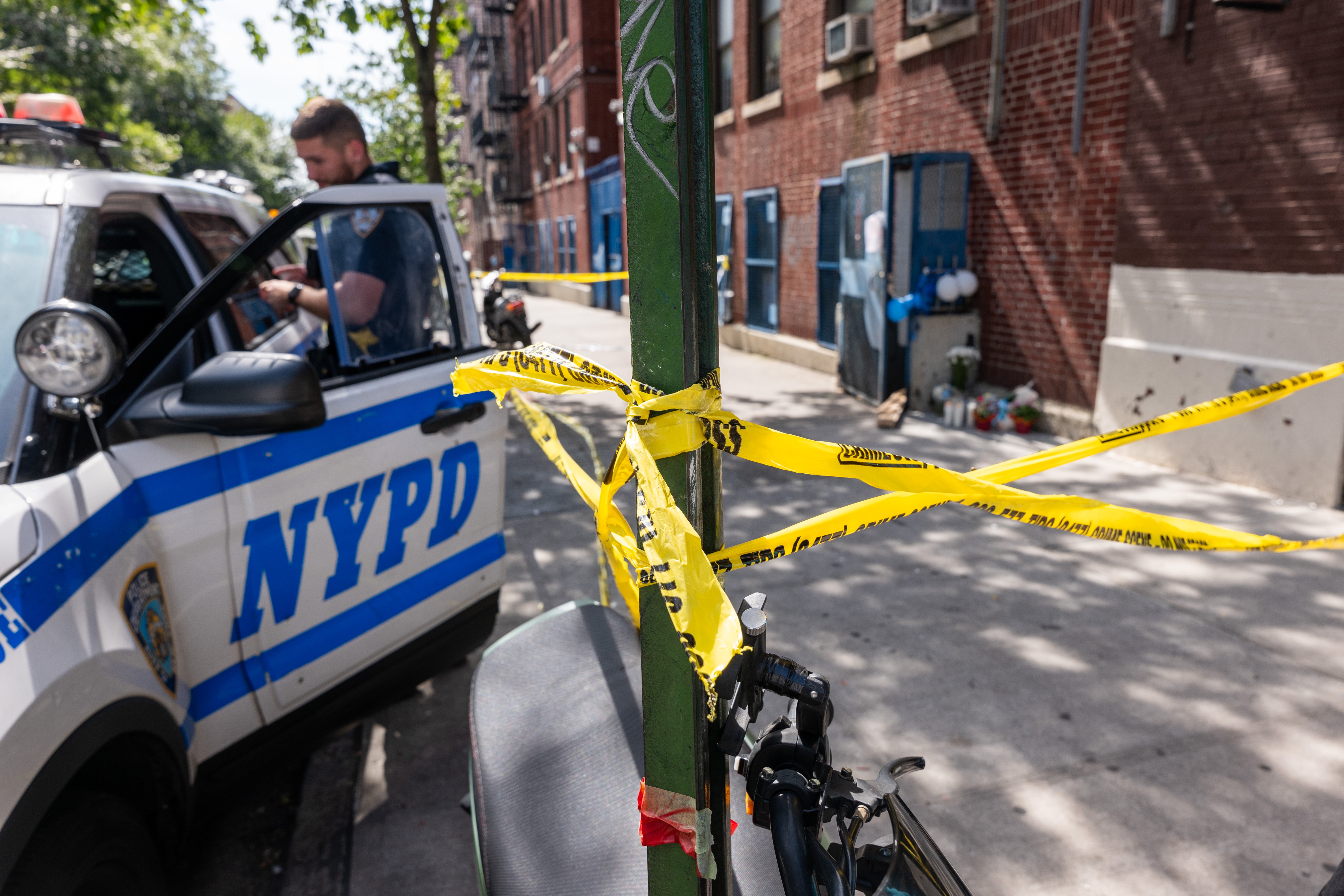 Police and crime scene investigators work at a Bronx daycare centre