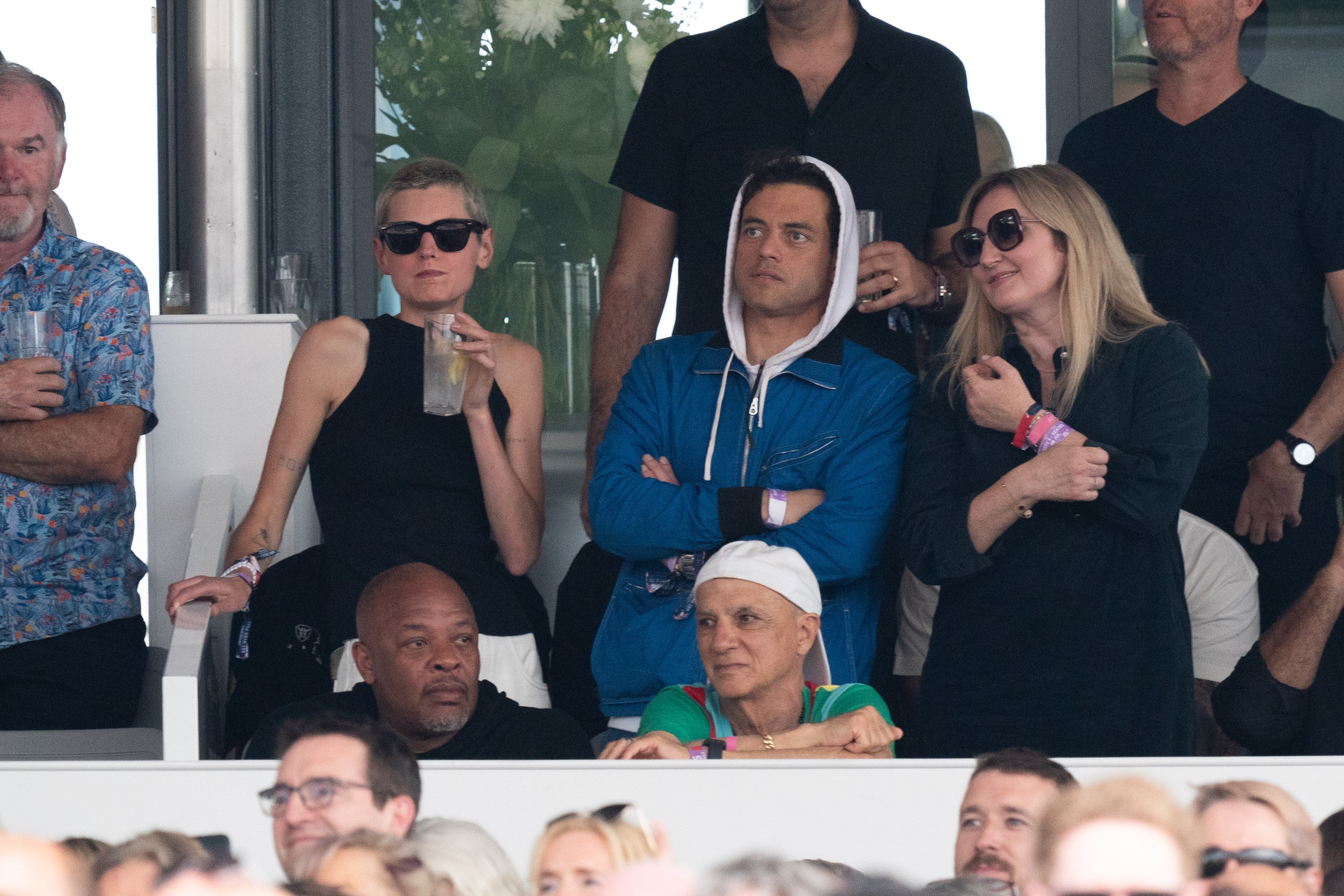 Corrin (left) and Malek watch Bruce Springsteen and the E Street Band performing on stage at BST Hyde Park