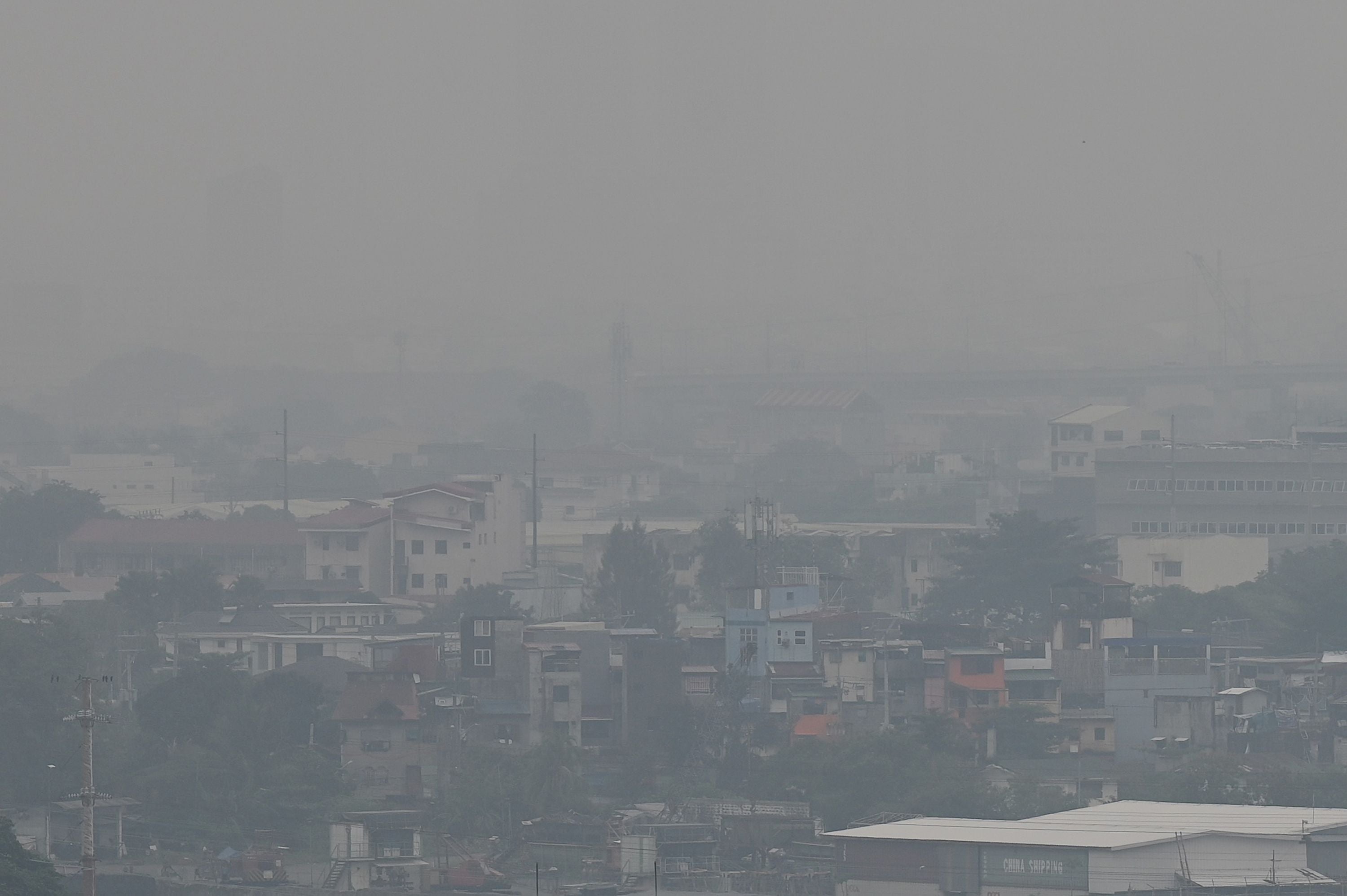 The Manila skyline is seen shrouded in smog