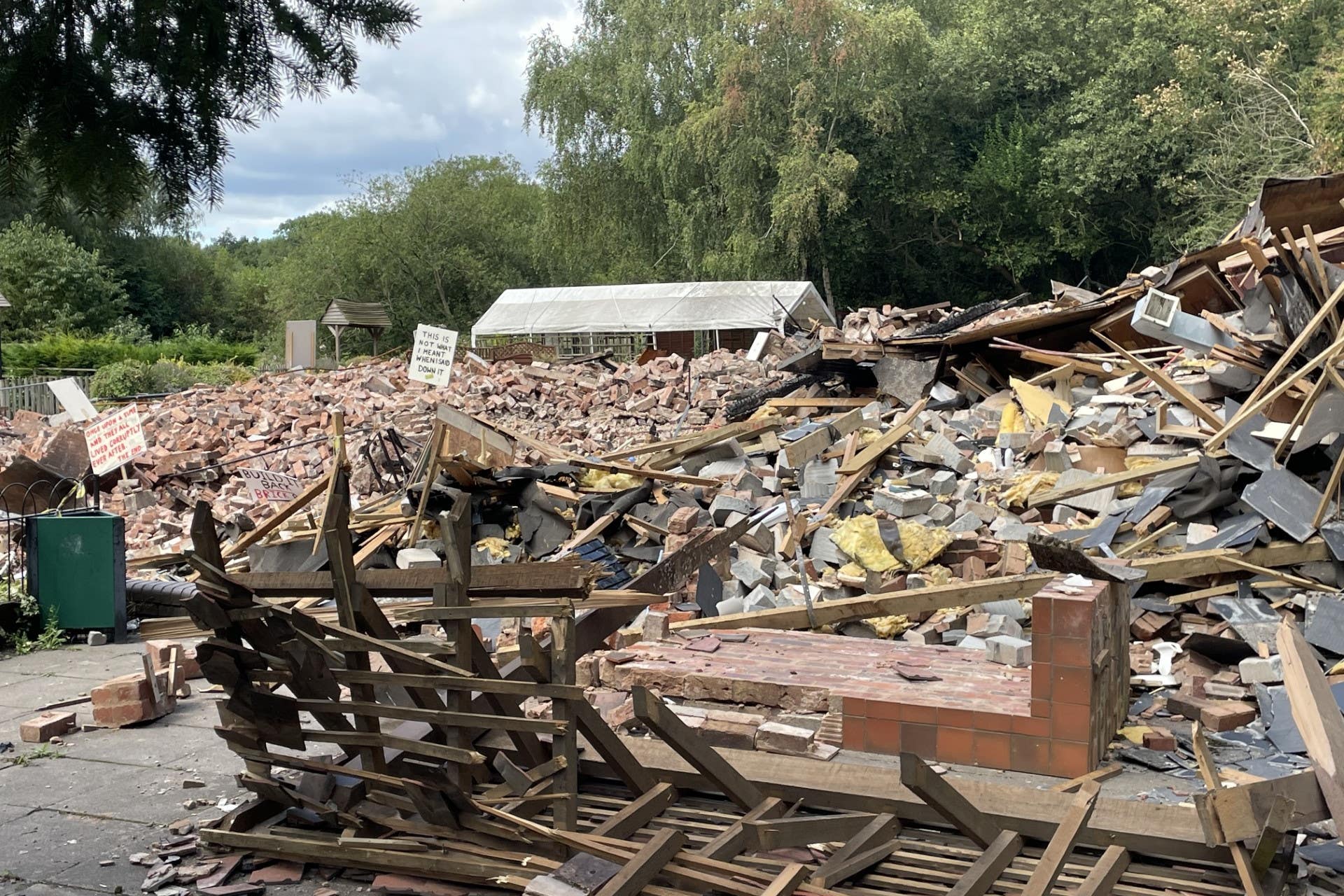 The Crooked House was not listed at the time it was destroyed but was a non-designated heritage asset registered on the Historic Environment Records as a building of local importance