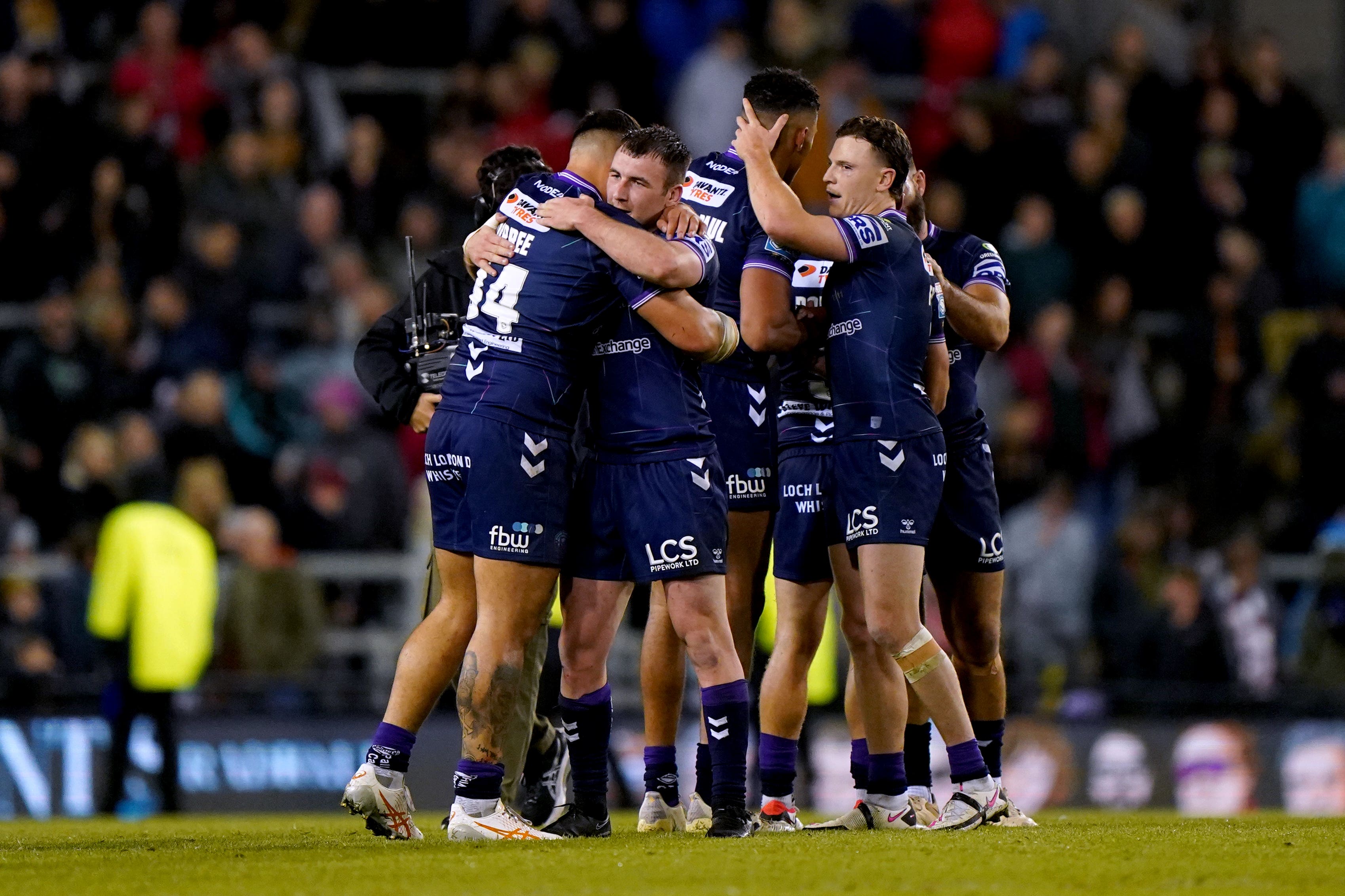 Wigan celebrate after winning the League Leaders Shield (Tim Goode/PA)