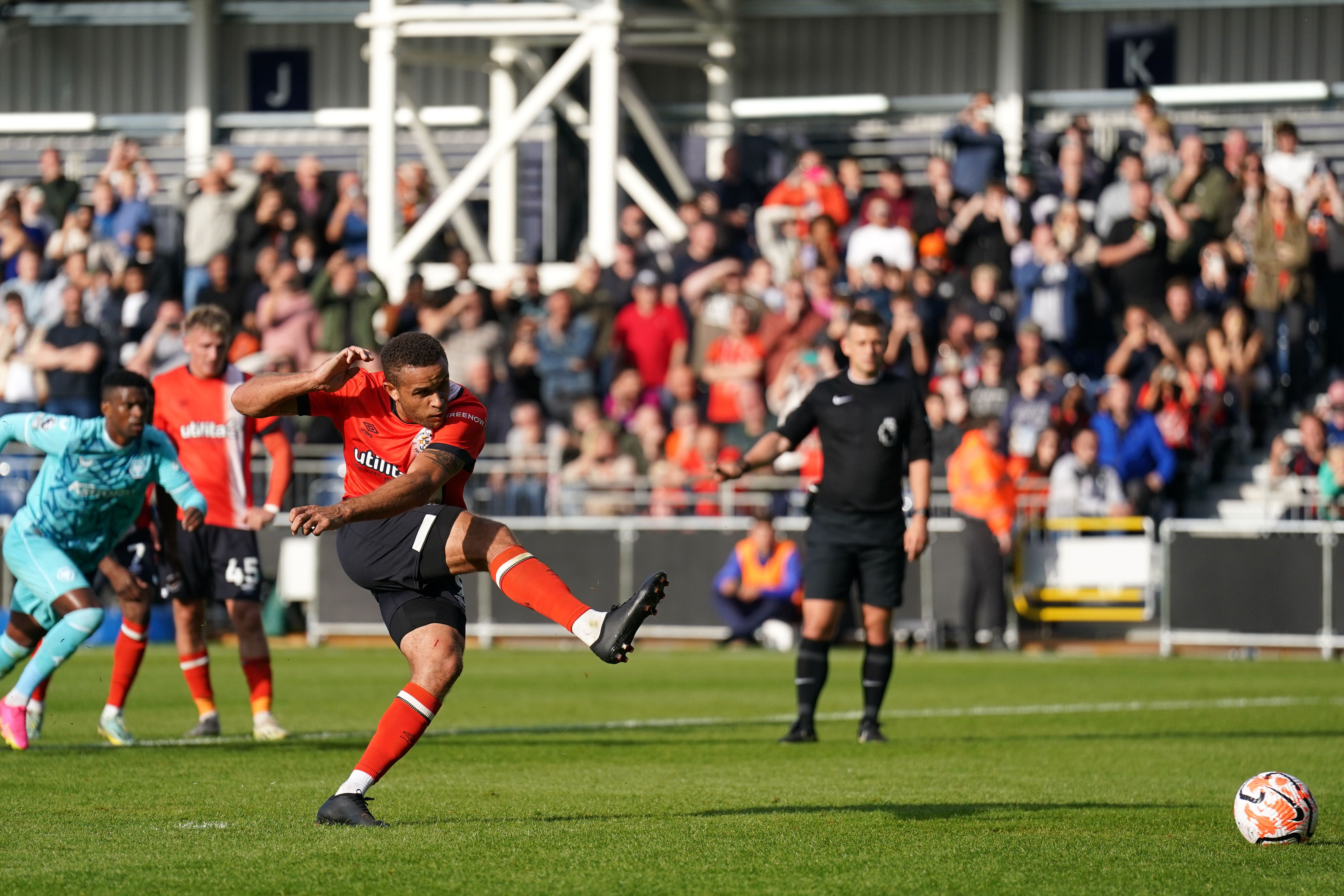 Carlton Morris scores the goal that earned Luton their first Premier League point (Joe Giddens/PA)