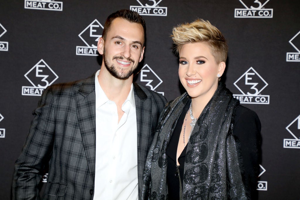 Nic Kerdiles (L) and Savannah Chrisley at the grand opening of E3 Chophouse Nashville on November 20, 2019