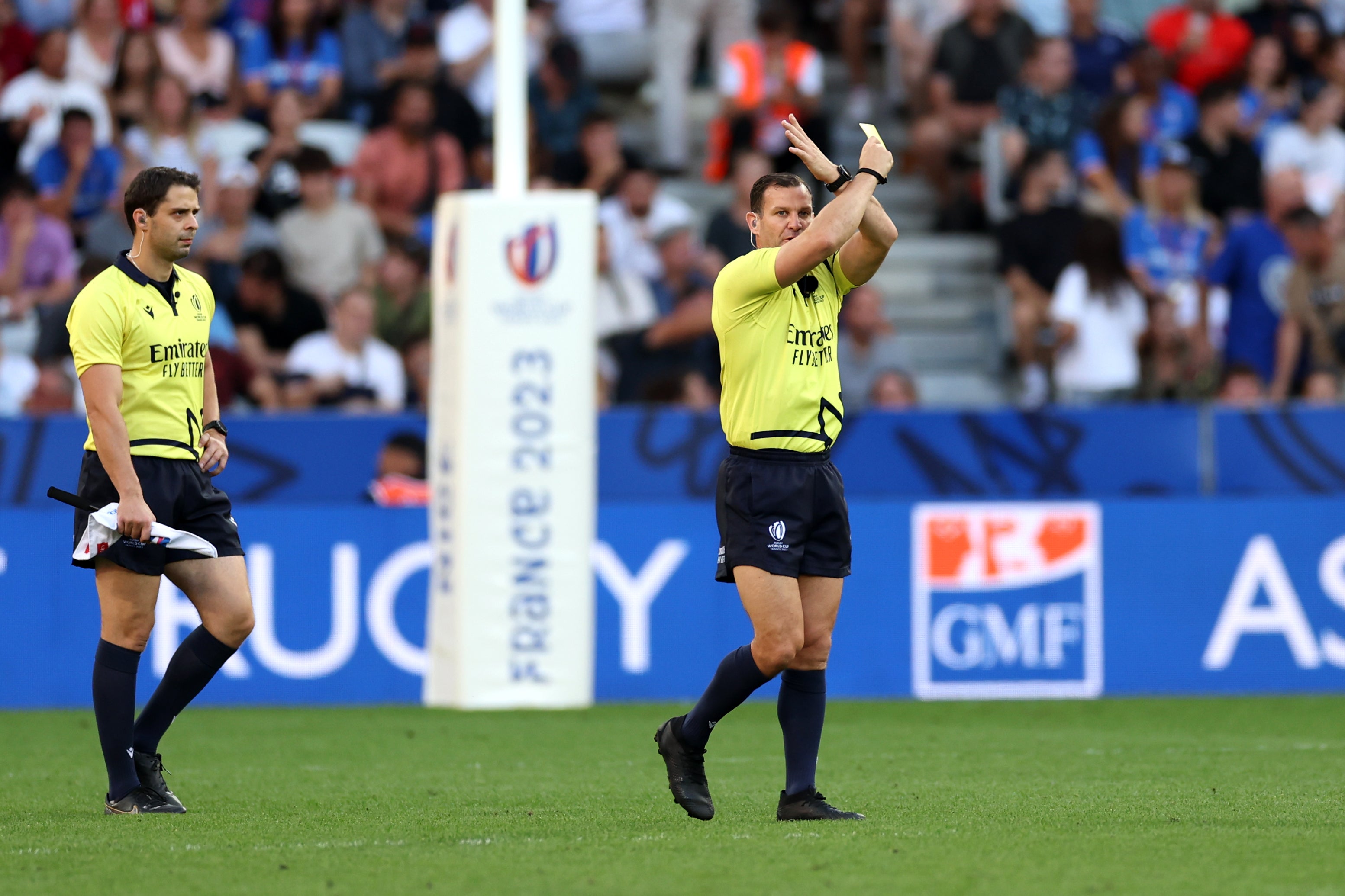 The referee crosses their arms to signal a Bunker review