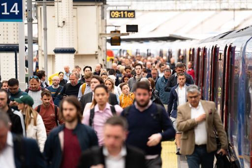 File photo: Rail passengers get off a train