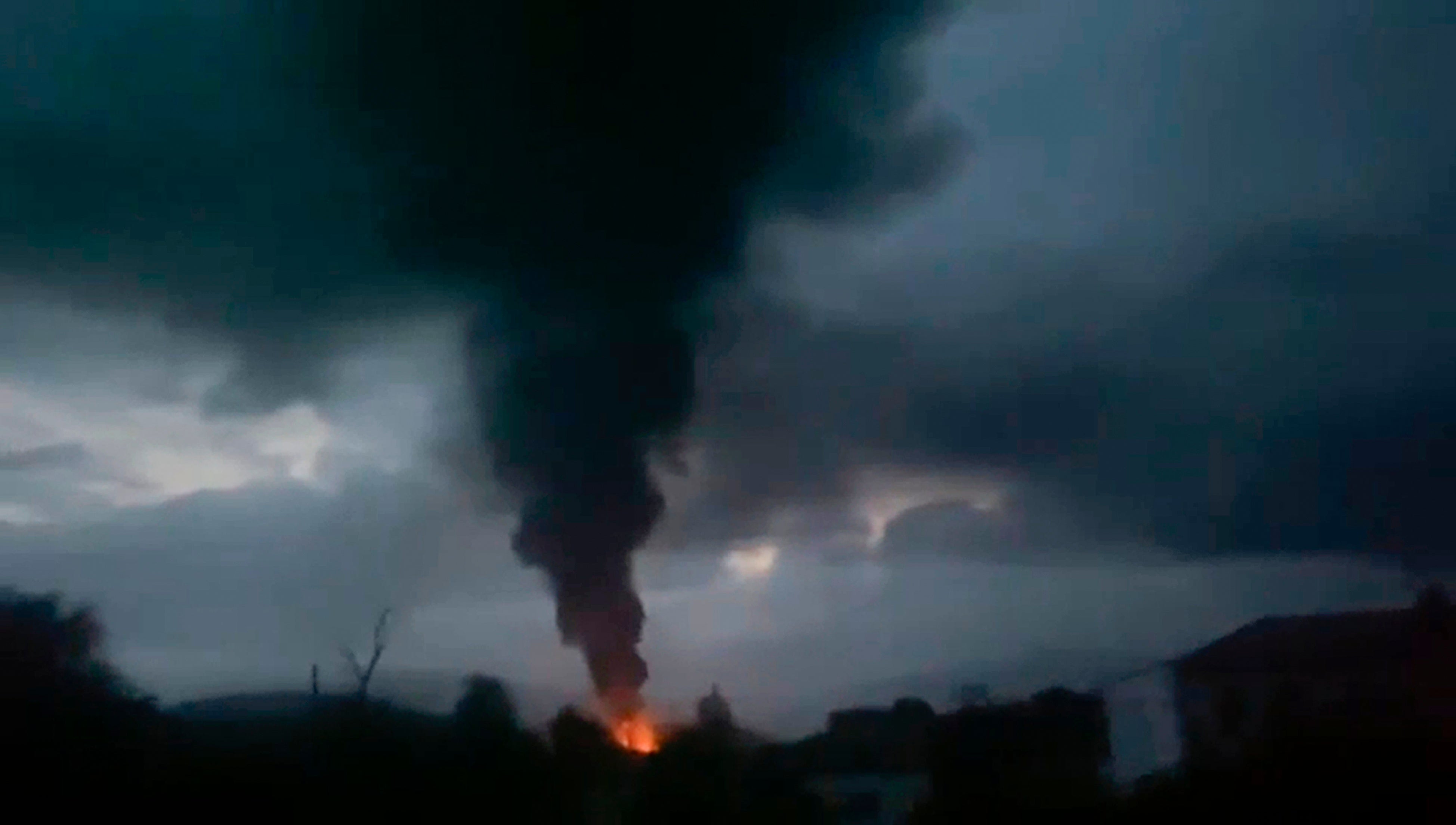 Smoke rising after a fuel depot explosion near Stepanakert