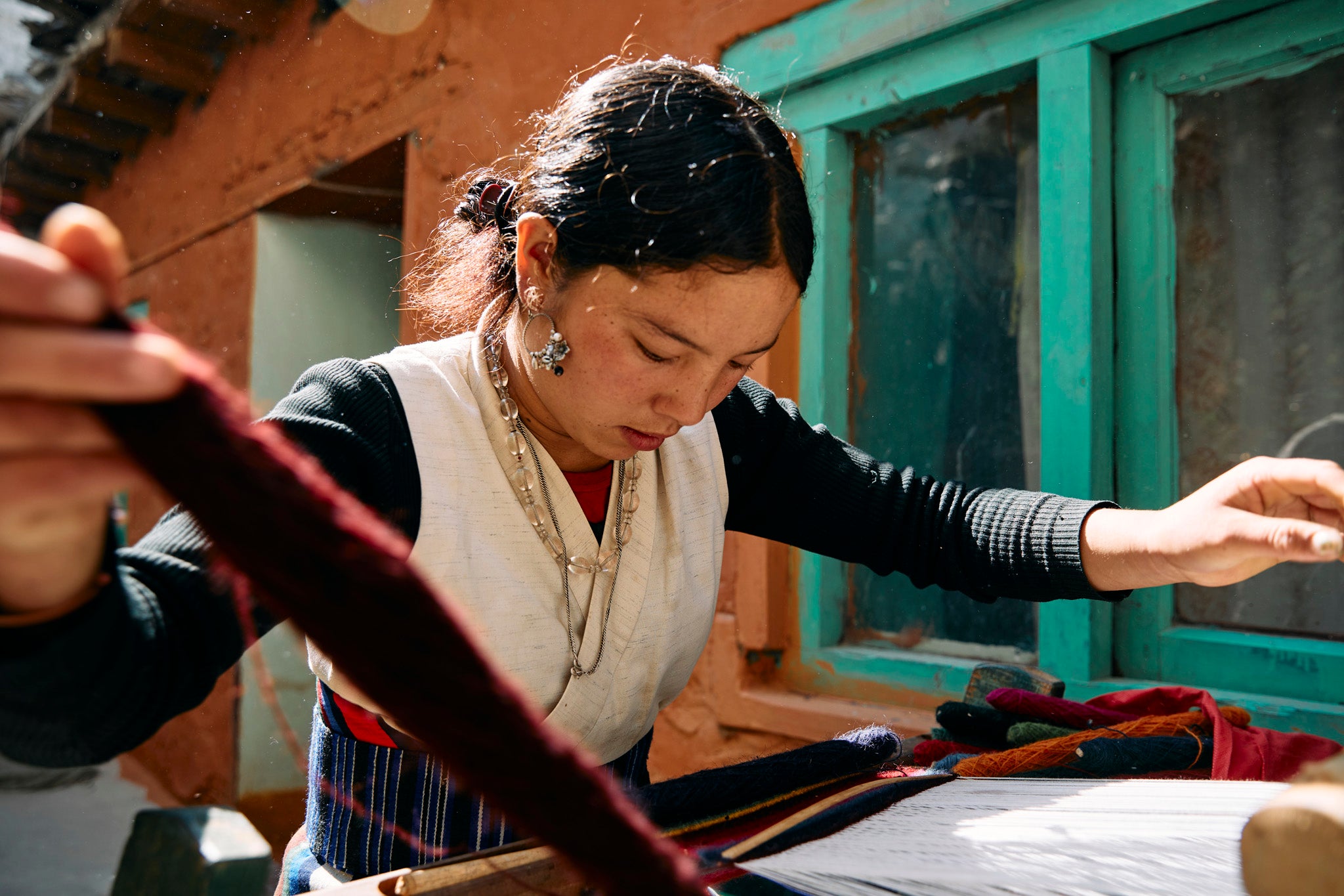 Chiring Dhaka Gurung, 22, says: ‘Symrik Cashmere is helping women in these remote regions to be able to support themselves through training in faster weaving techniques which increases output’