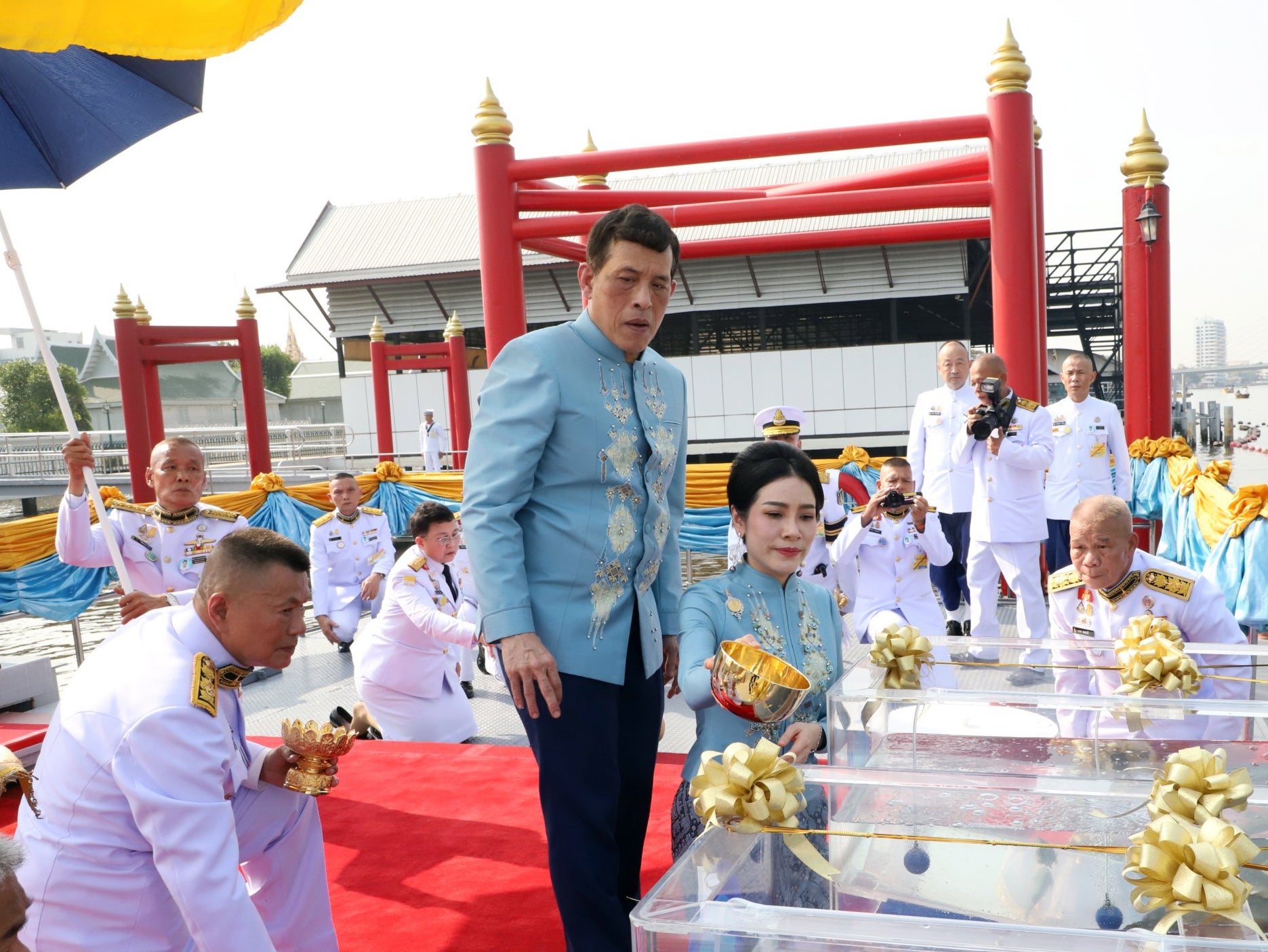 Thai King Maha Vajiralongkorn Bodindradebayavarangkun (C-L) accompanied by the Royal Consort Sineenat Wongvajirapakdi