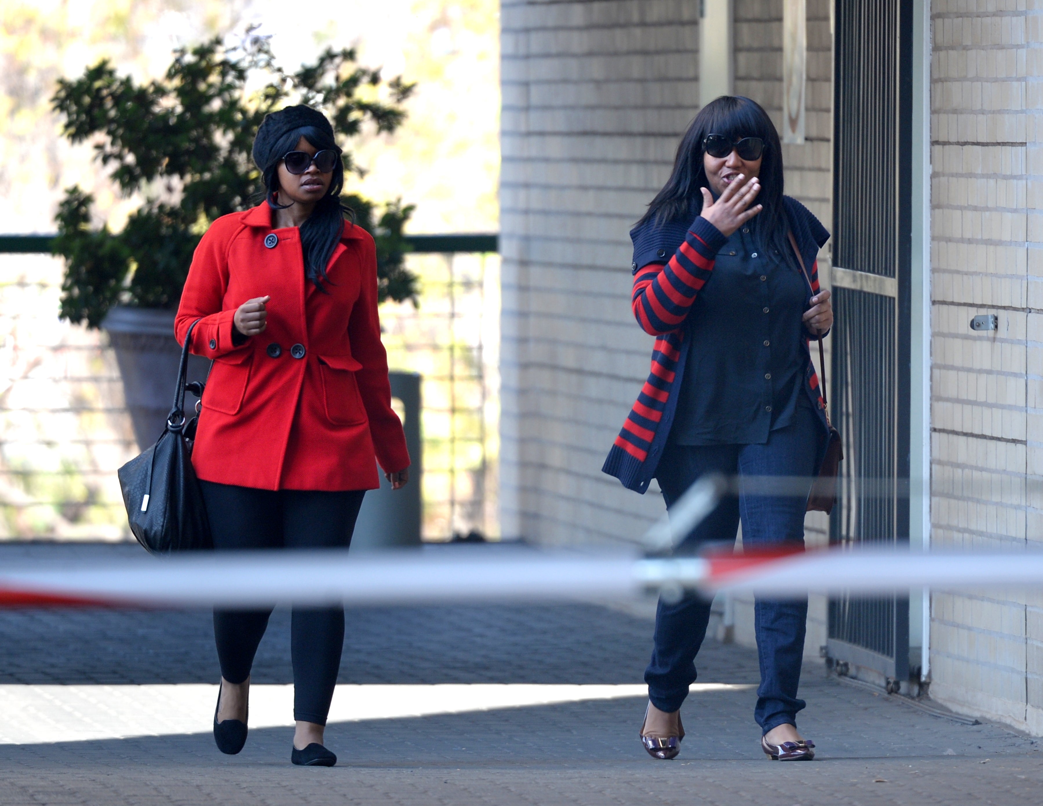 Nelson Mandela's grandaughter Zoleka (L) and Ndileka Mandela arriving at the MediClinic Heart hospital in Pretoria to visit their grandfather