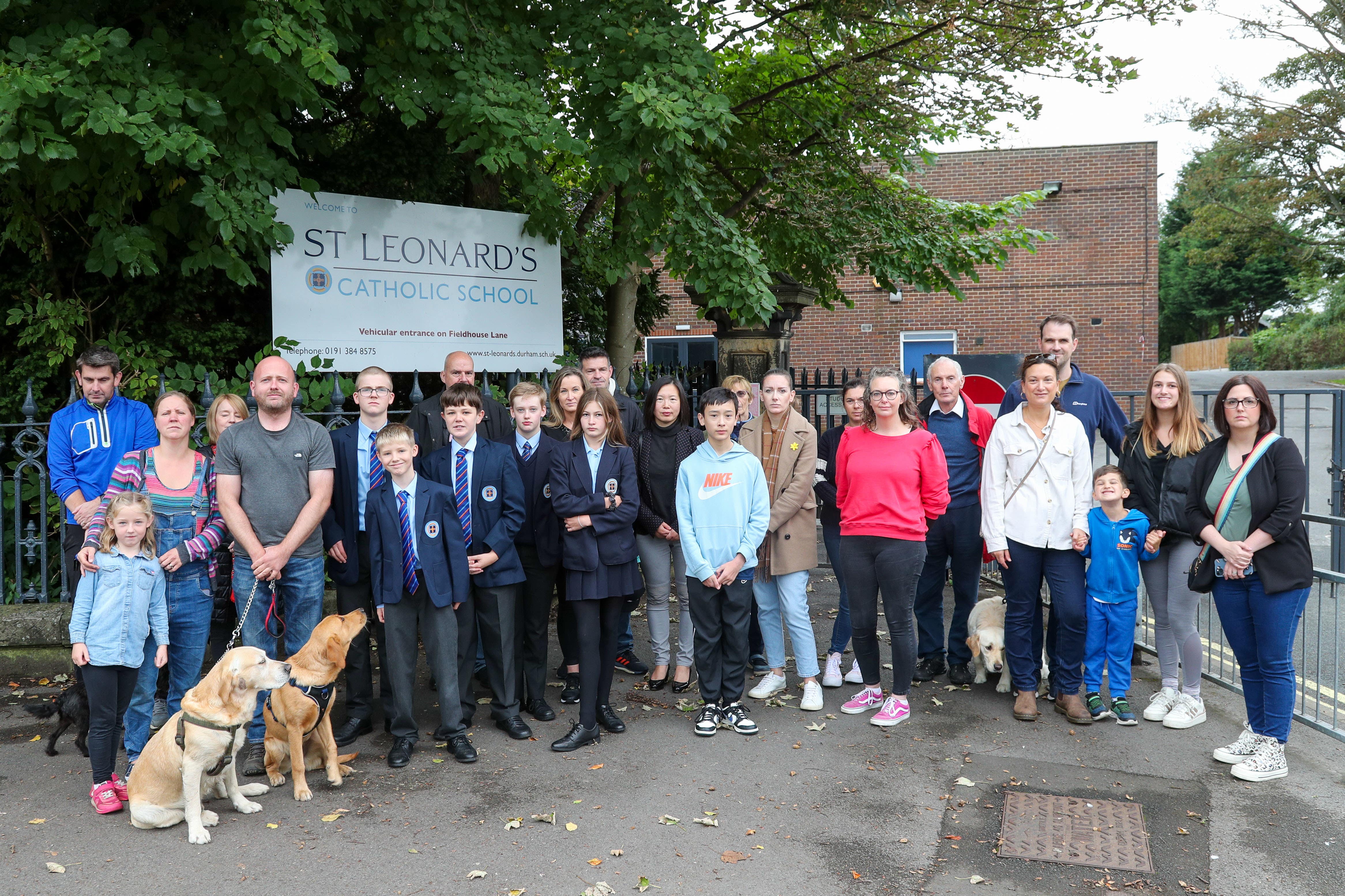 Pupils and parents outside St Leonard’s Catholic School in Durham which has largely closed due to the reinforced concrete crisis (Tom Banks/PA)