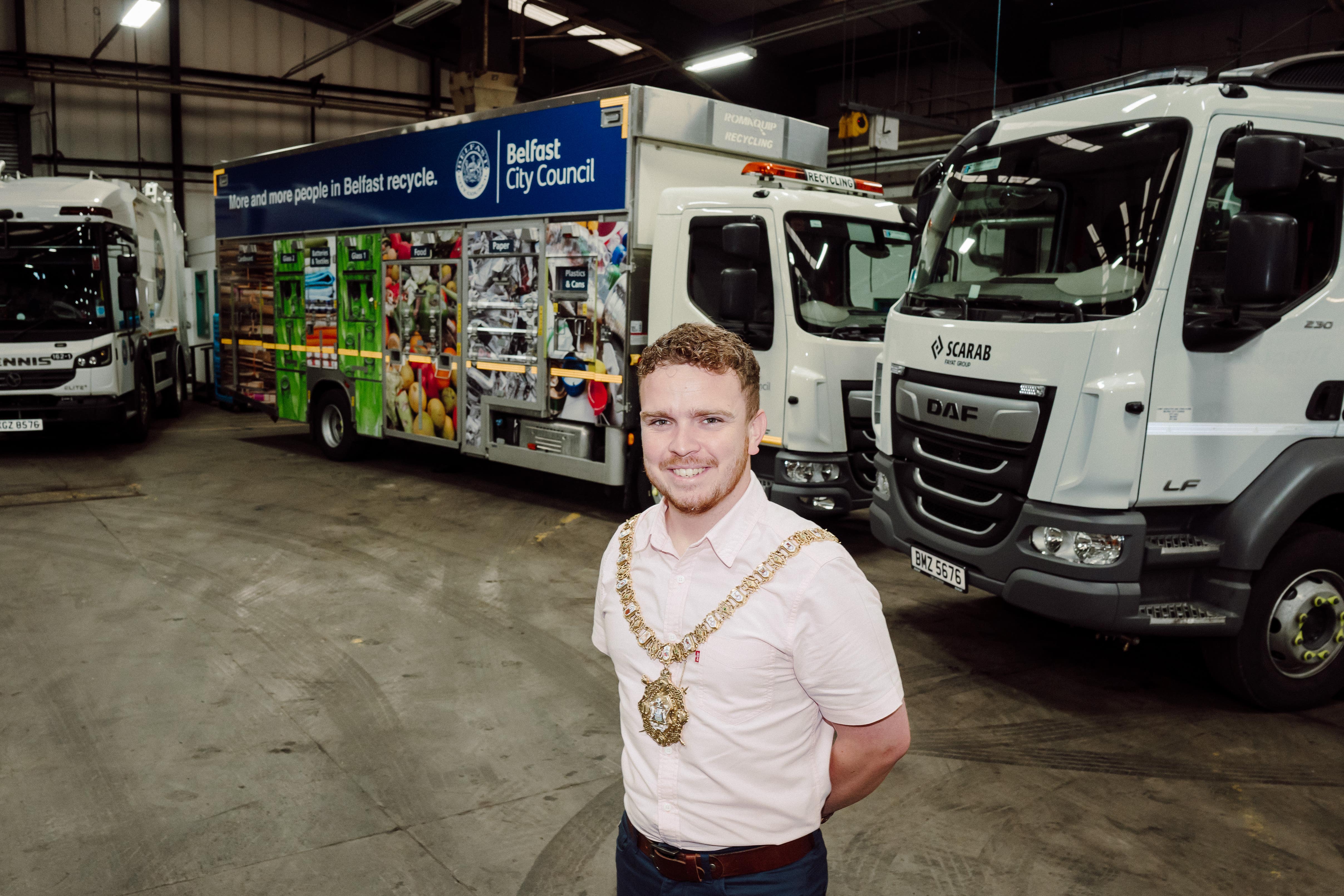 Lord Mayor of Belfast Councillor Ryan Murphy at the Duncrue Complex alongside council HGVs running on hydrotreated vegetable oil (BCC/PA)